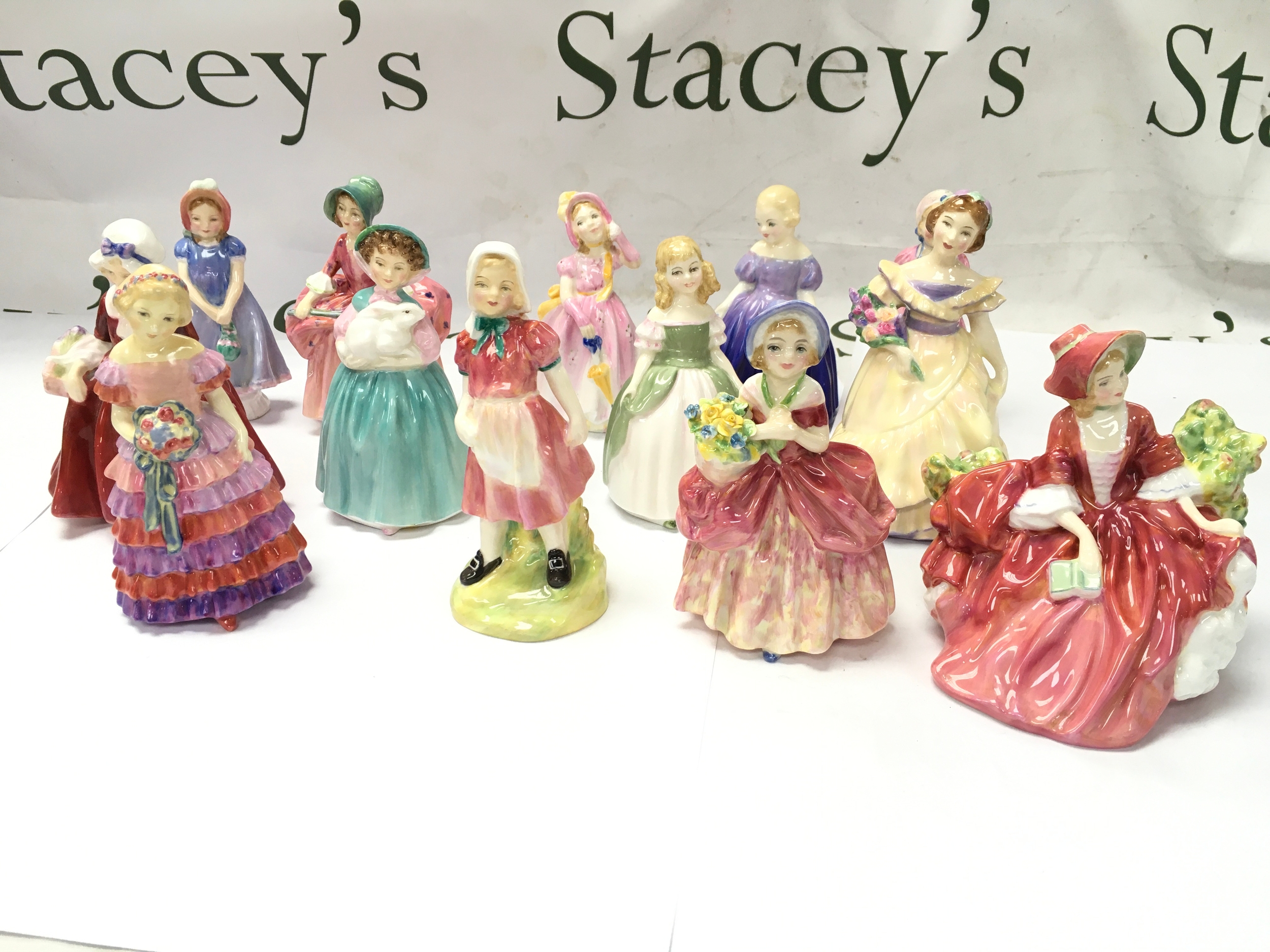 Porcelain lady and child figurines, Royal Doulton pieces such as designs like Diana HN1986 and various Ladies historic character studies. items all appear in excellent condition with no obvious signs of damage or repair.