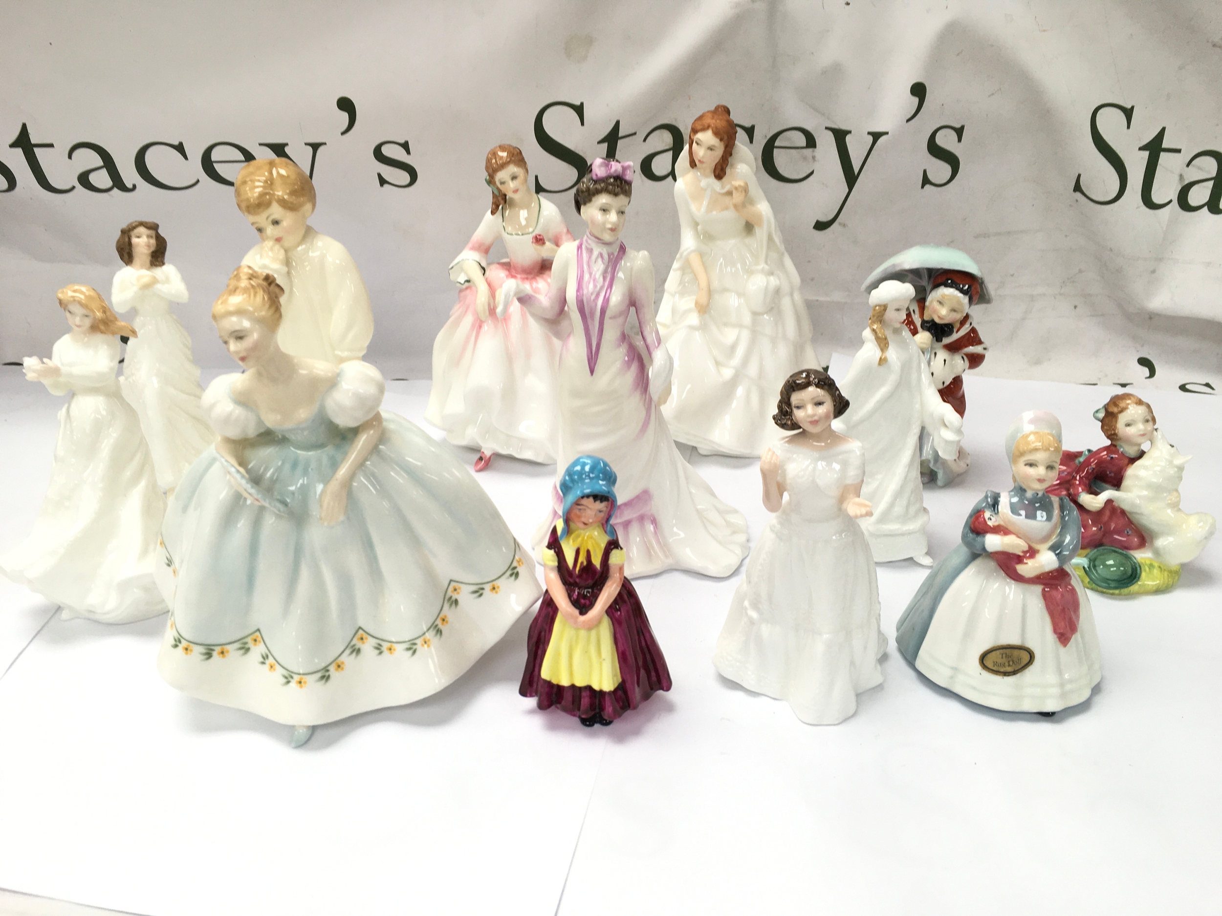 porcelain and bone china lady and character figurines, from Royal Doulton. All appear in good condition with no obvious signs of damage or repair.