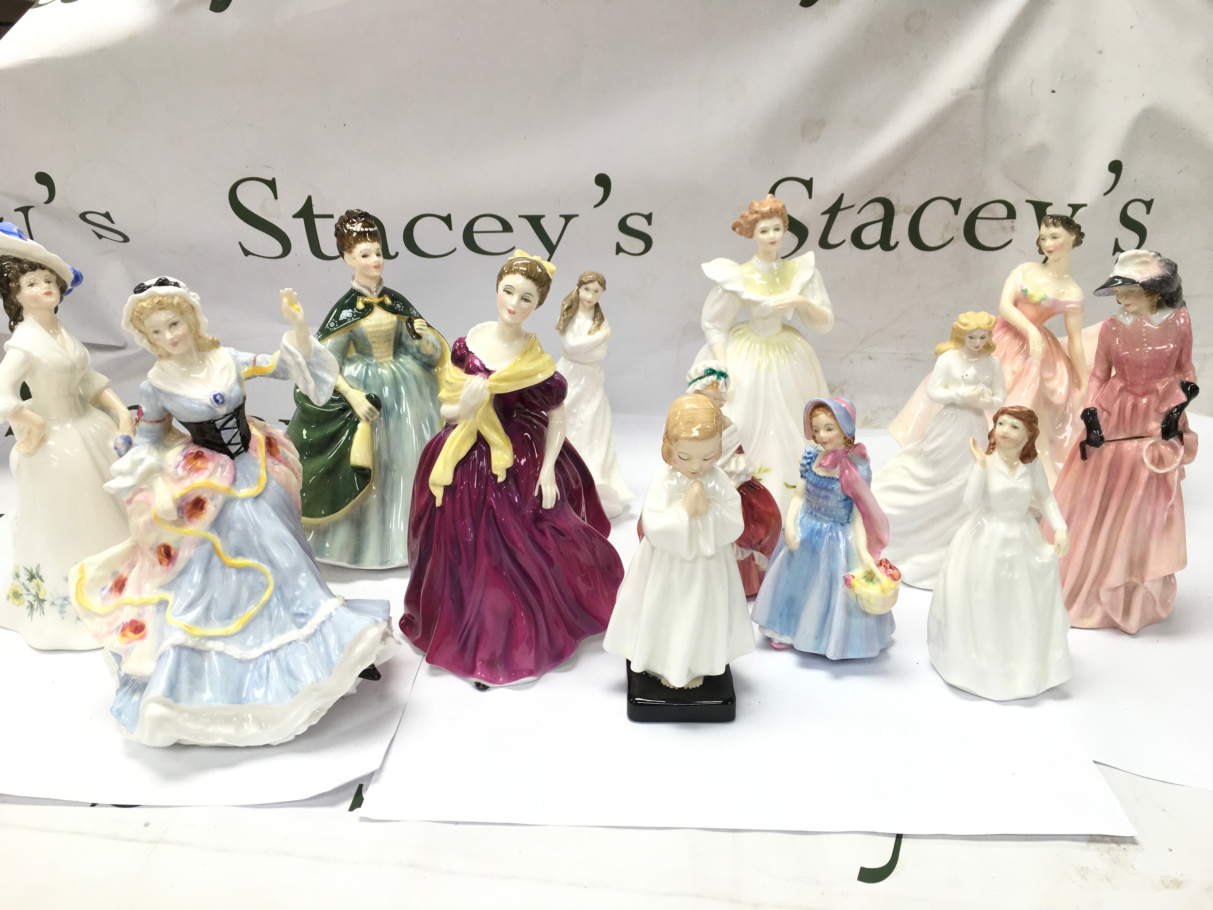 collection of vintage porcelain and bone china decorative figurines by Royal Doulton. All appear in good condition with no obvious signs of damage or repair.