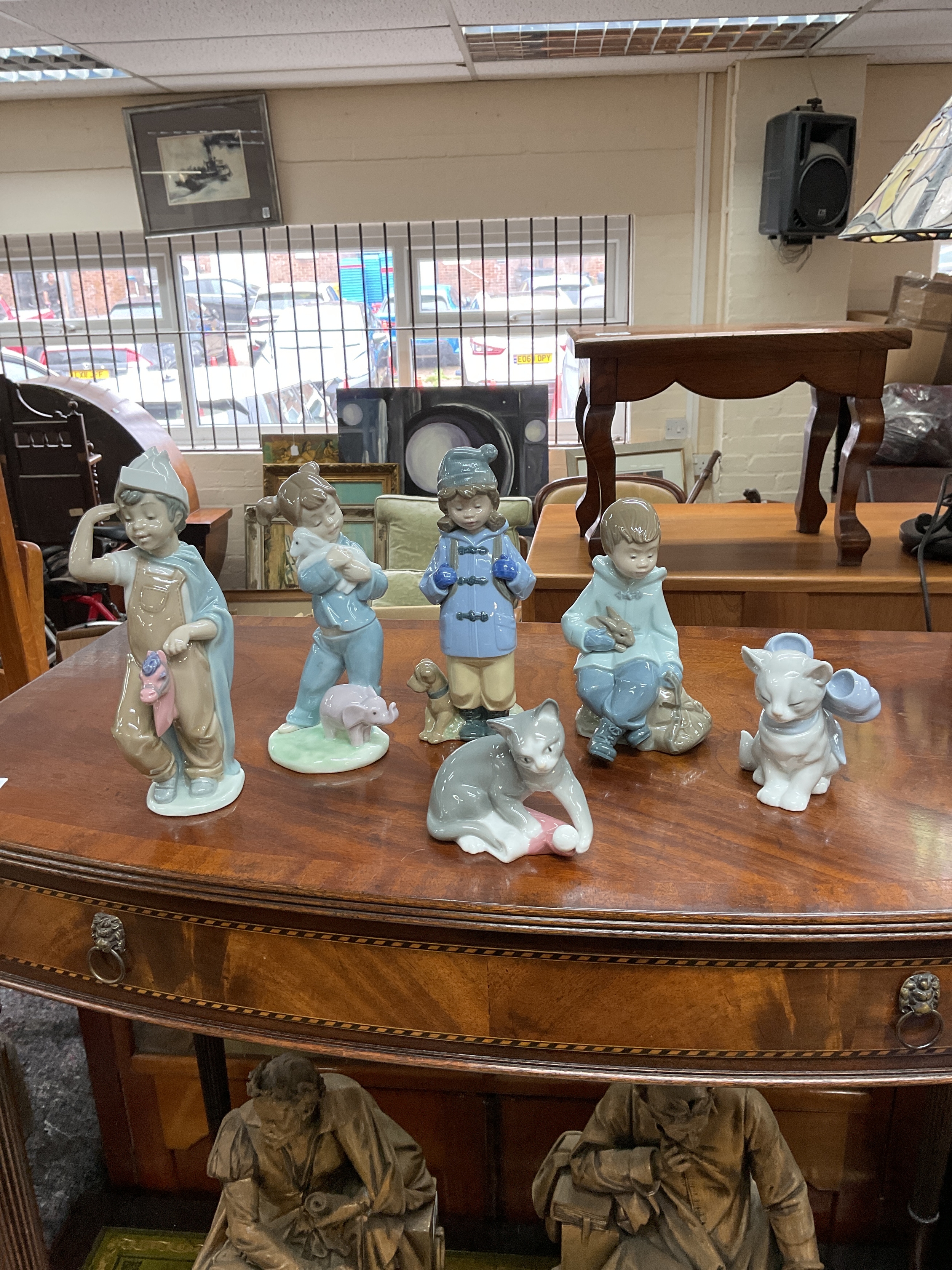Six NAO figurines.