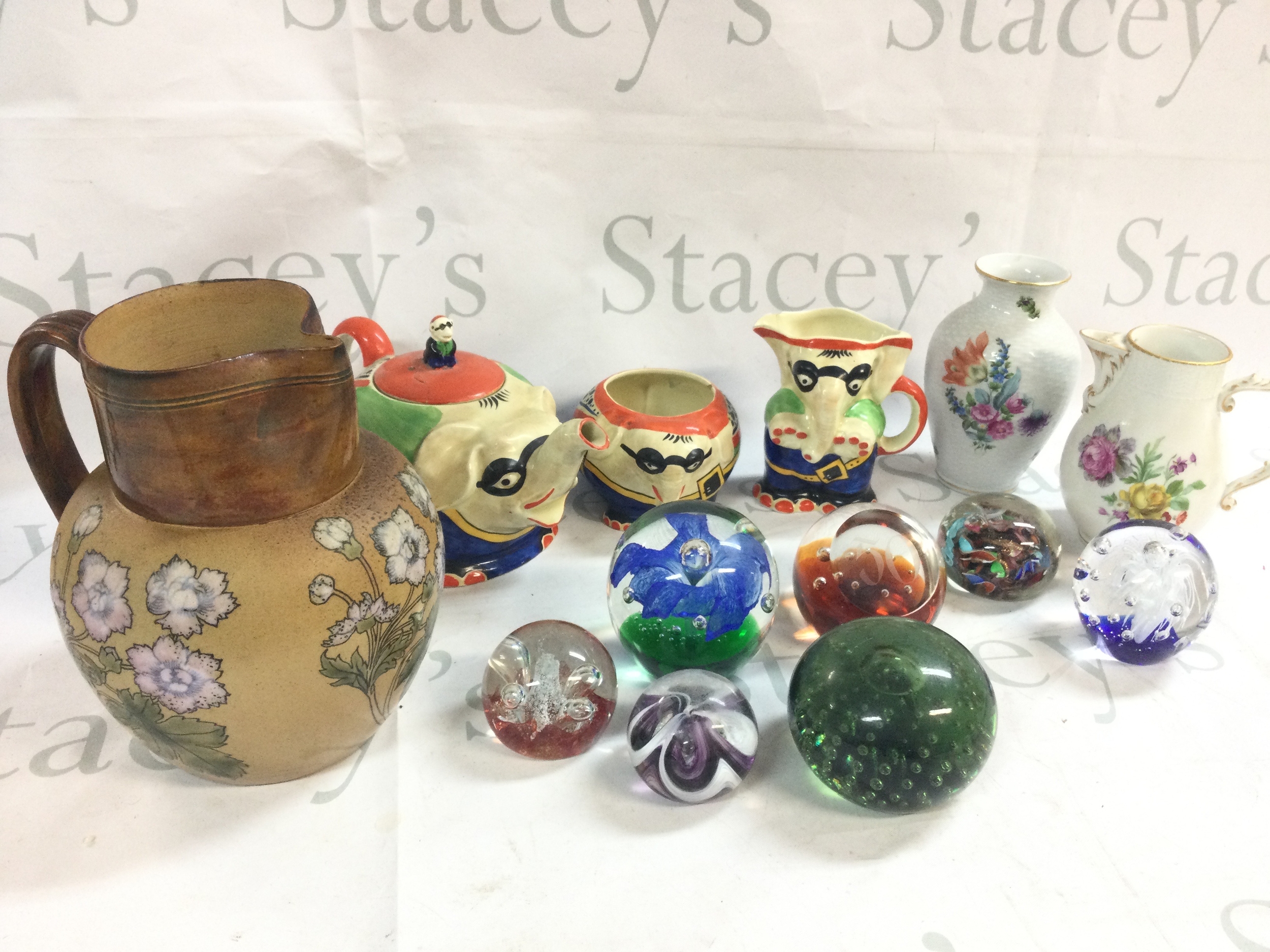 A large collection of ceramics including Royal Venton ware J Stevenson & sons, paperweights, Royal Doulton Lambeth jug