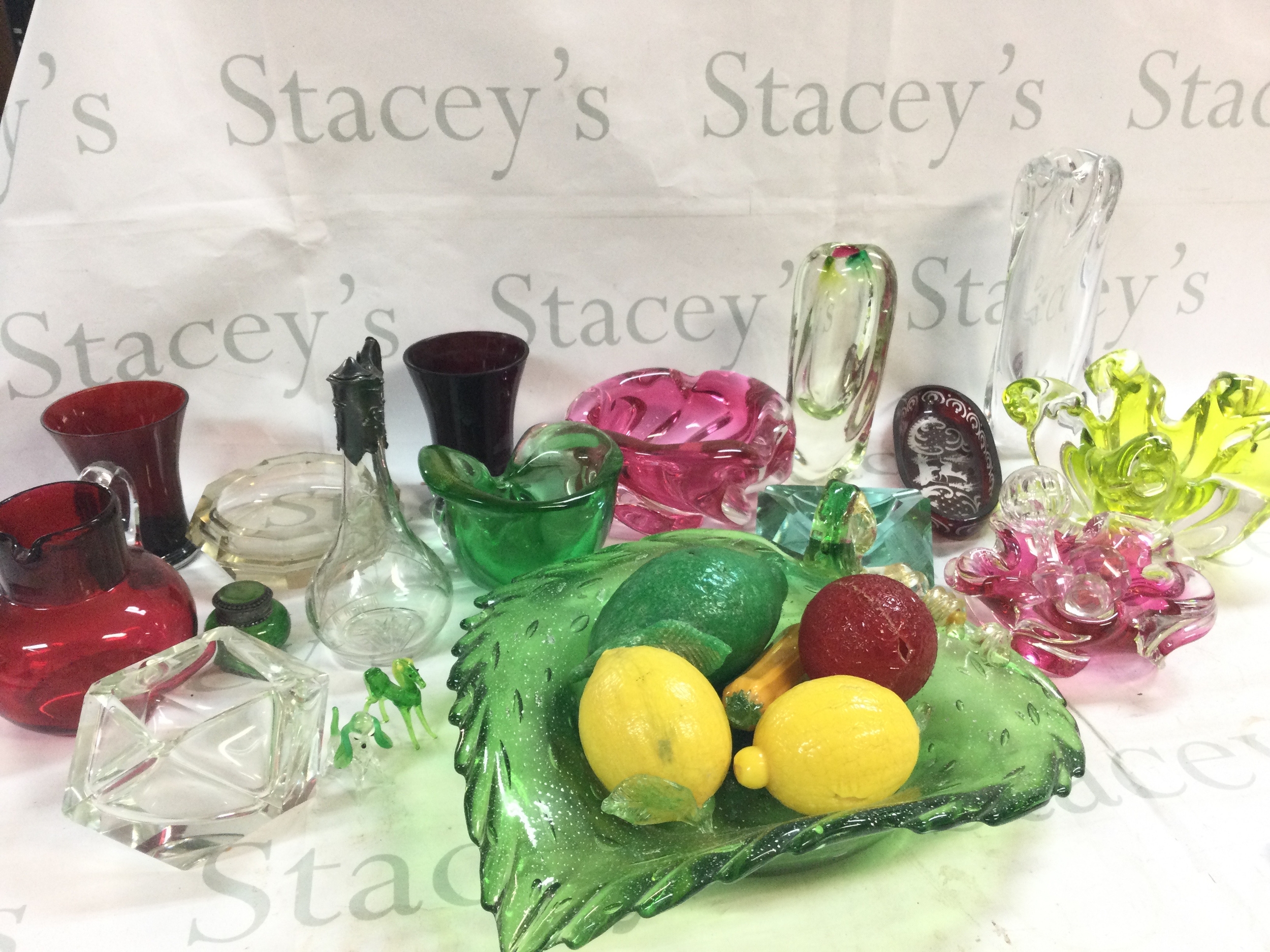 A collection of art glass ceramics including bowls, vases, jugs 