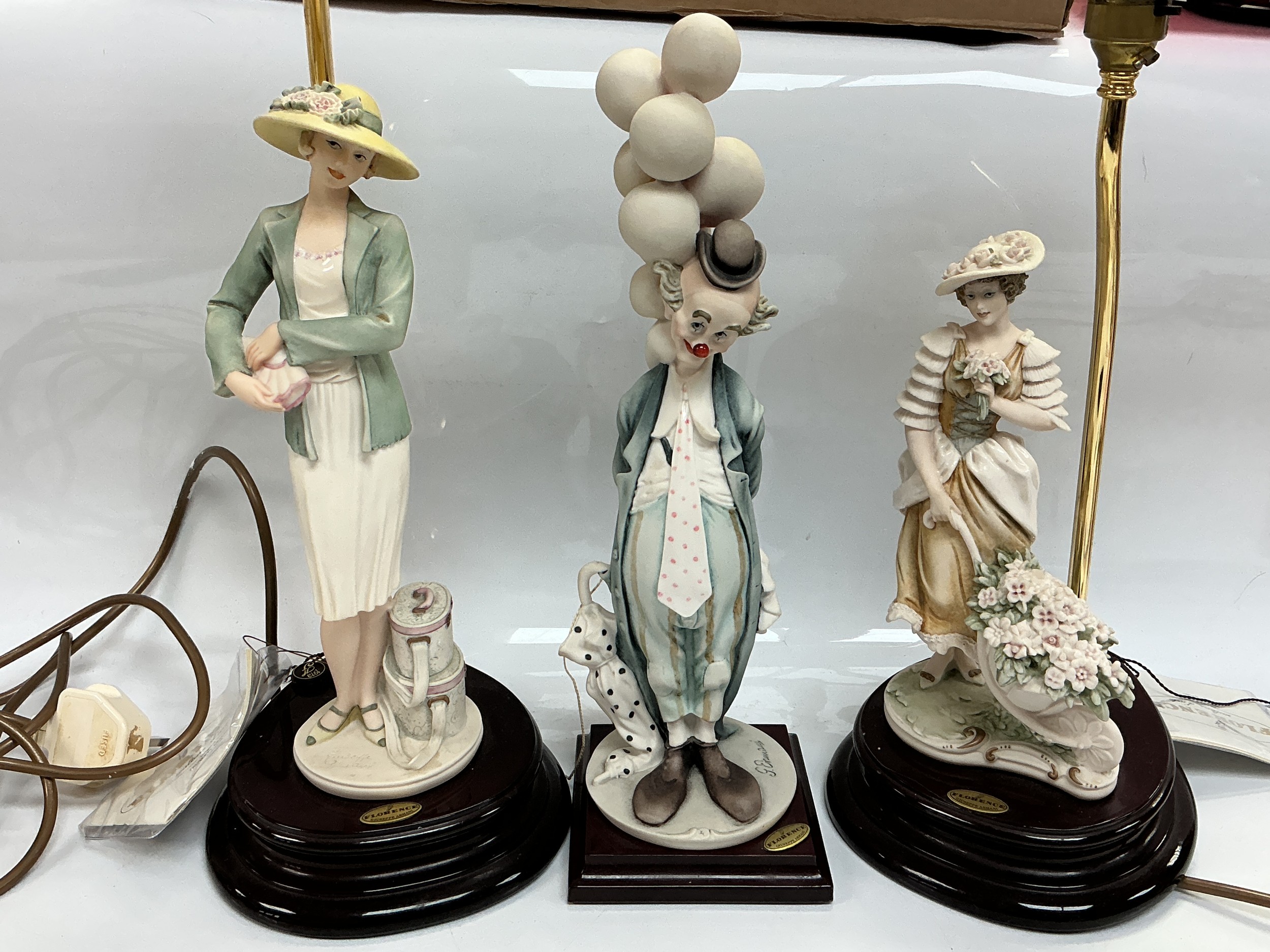 Three boxed Capodimonte figural table lamps by Guiseppe Armani, tallest approx 46cm including lamp fitting.