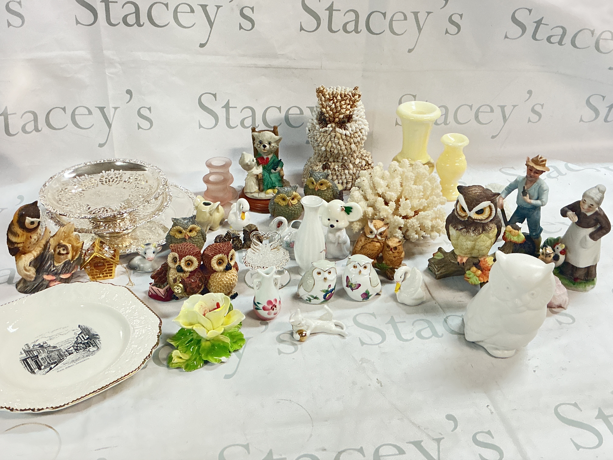 A collection of ceramics including owls, coral, Haworth Britannia design plate, candlesticks etc
