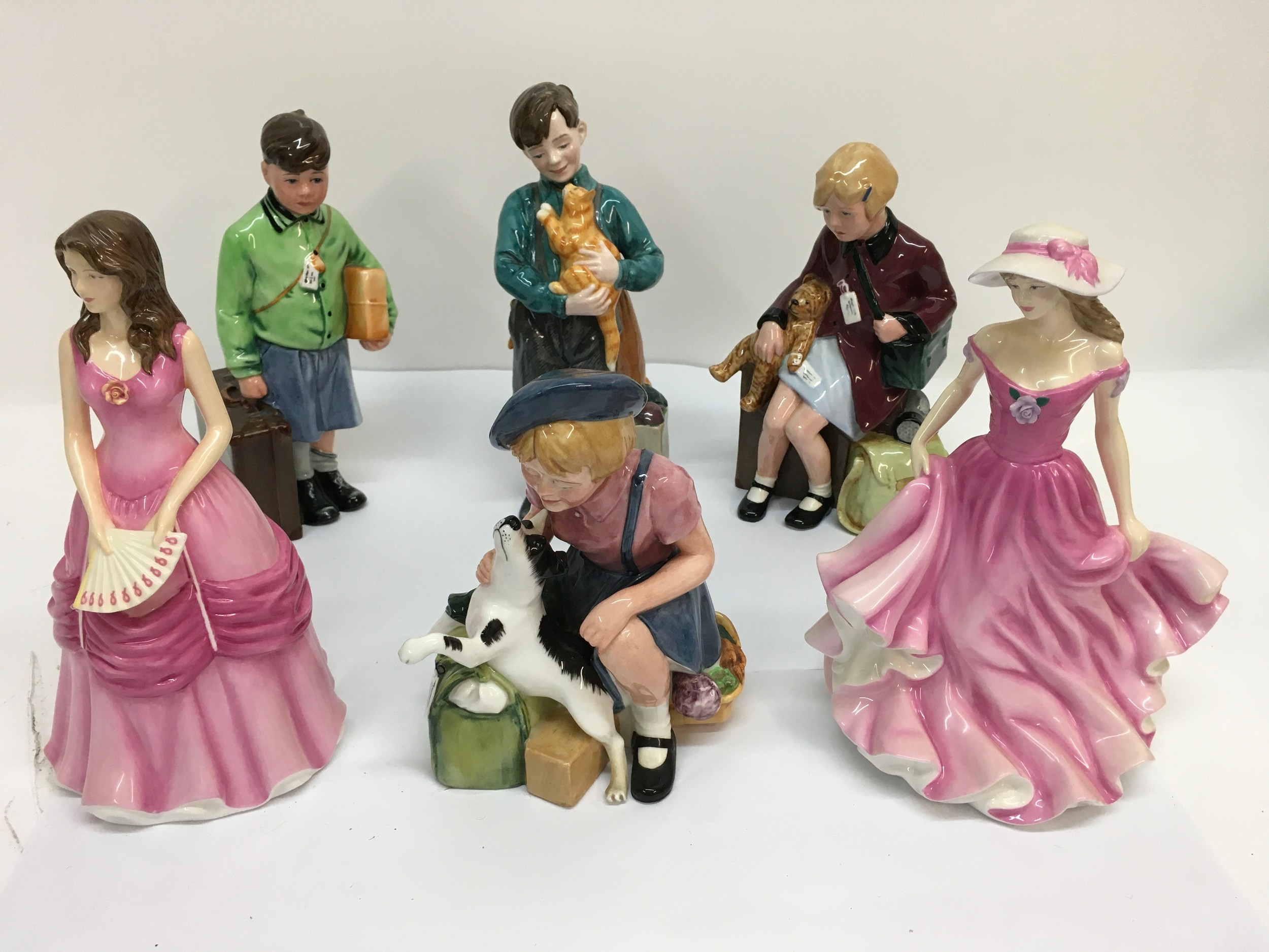 Six Royal Doulton figurines including four evacuee examples.
