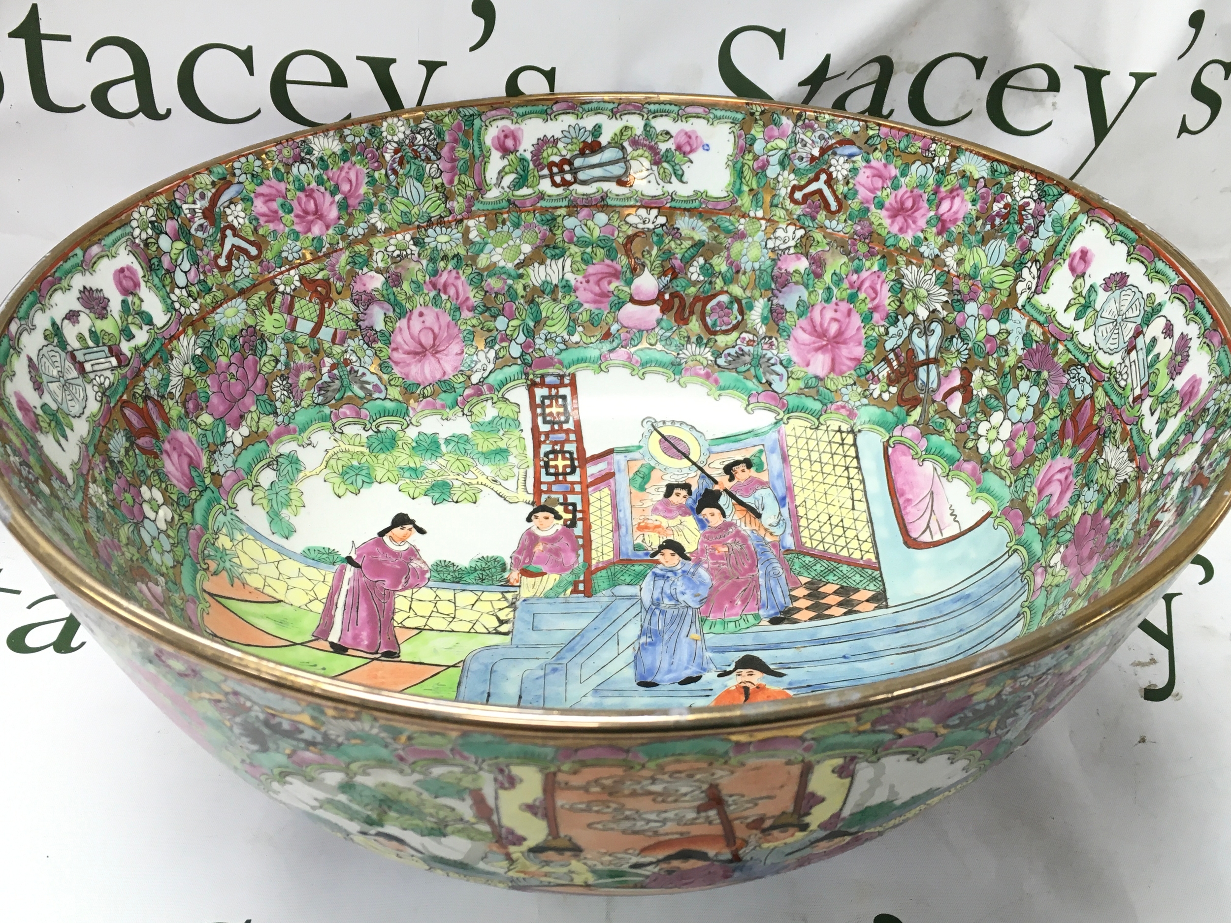 A Chinese Famille Rose bowl with a red six character mark at base. 41x40cm wide. 18.5cm tall