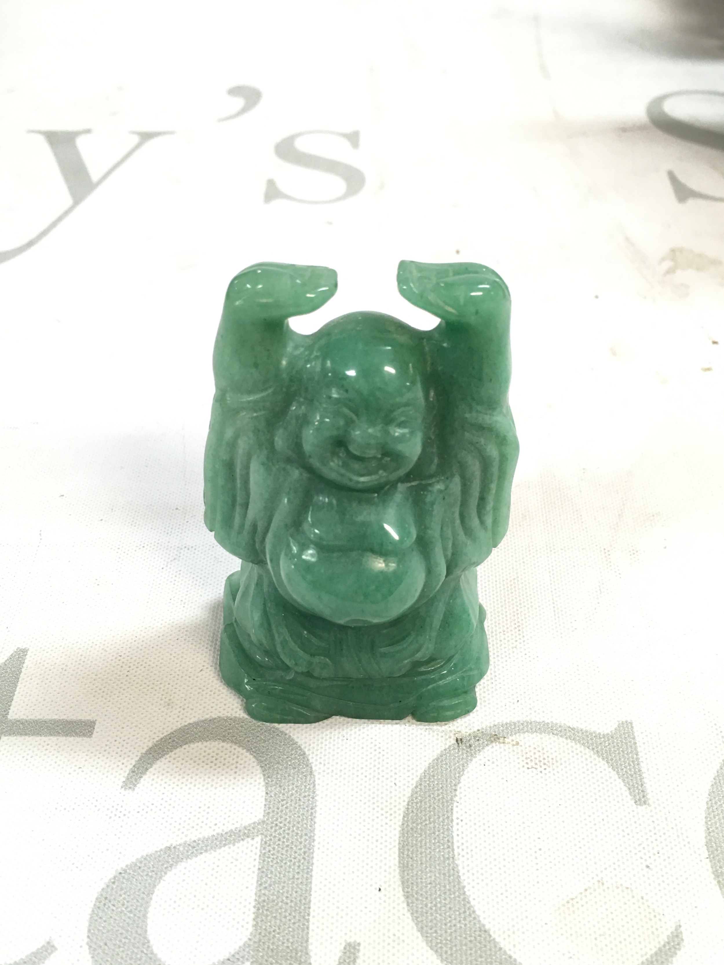 A 20th century small jade Buddha. Height 7cm. 