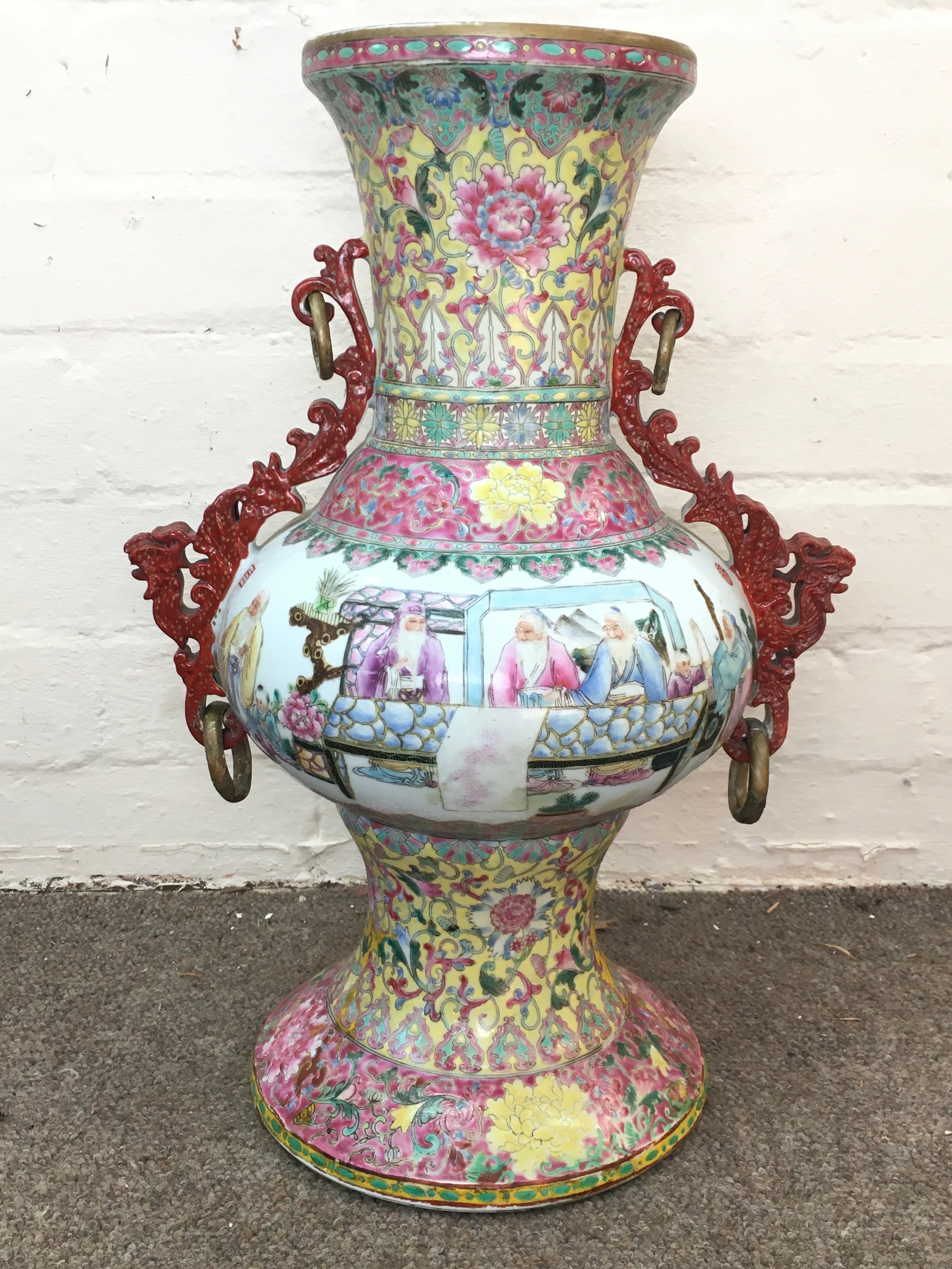 A Chinese republic famille rose vase with applied side handles, rings and hand-painted figural court scenes. 42cm tall
