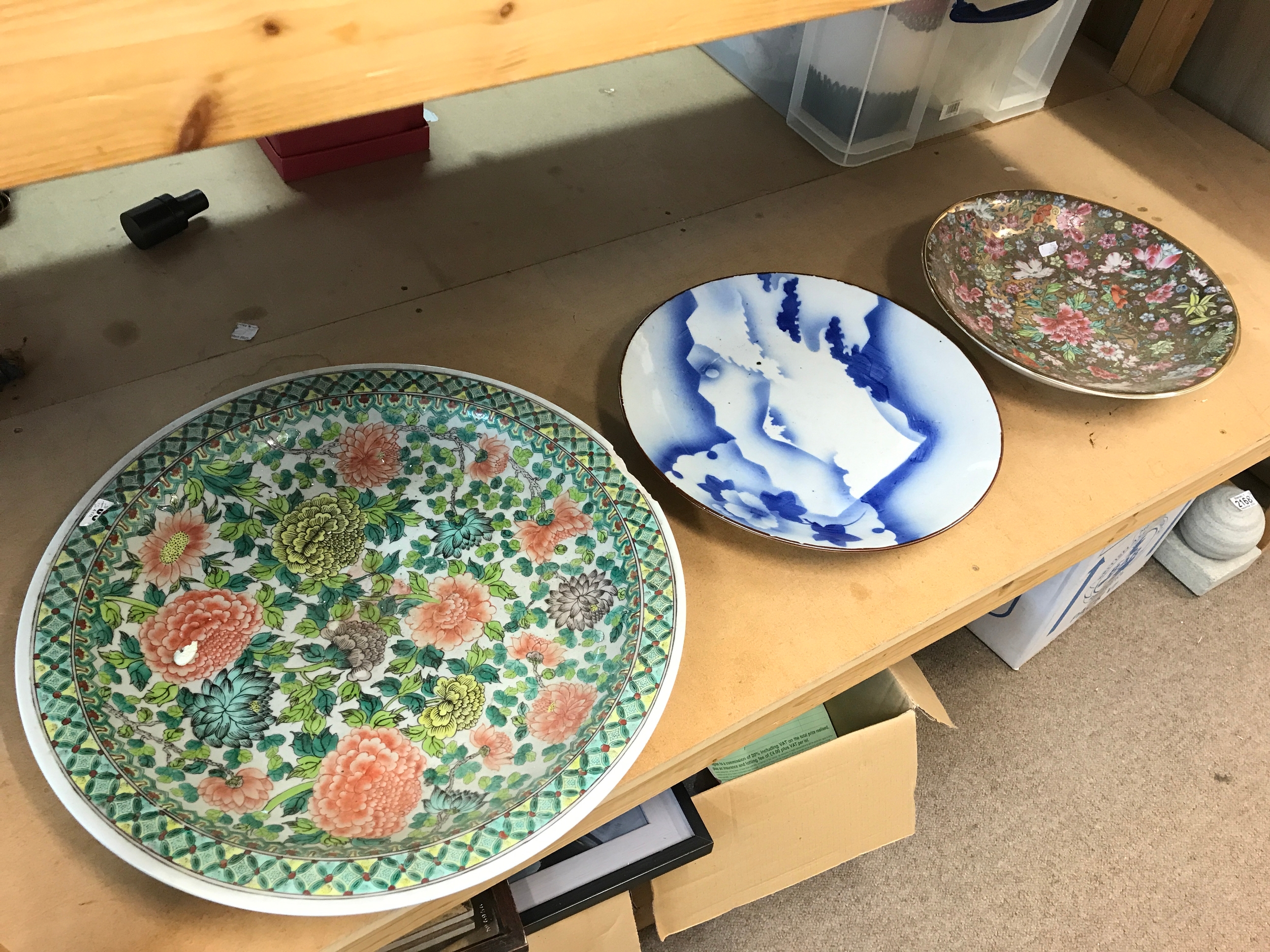 Three Chinese porcelain chargers 52 to 36cm wide. Some damage
