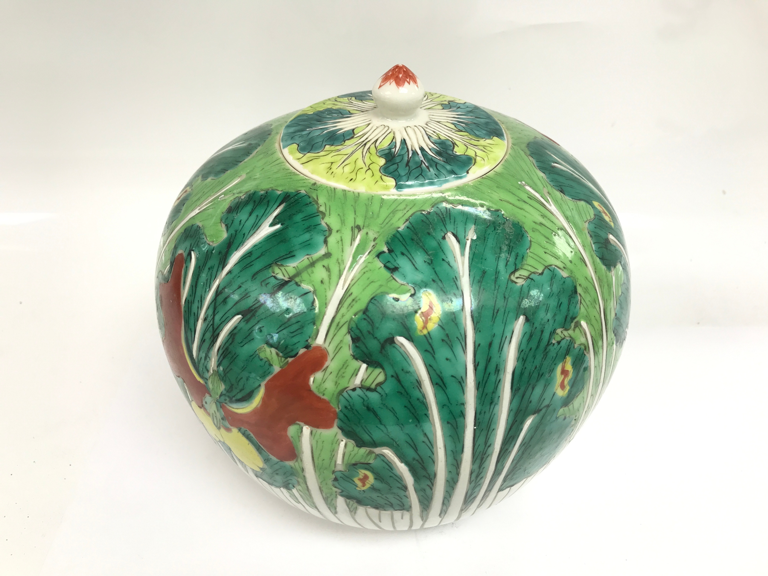 Chinese porcelain ginger jar and cover featuring a hand-painted green cabbage leaf and butterfly motif. 20cm tall