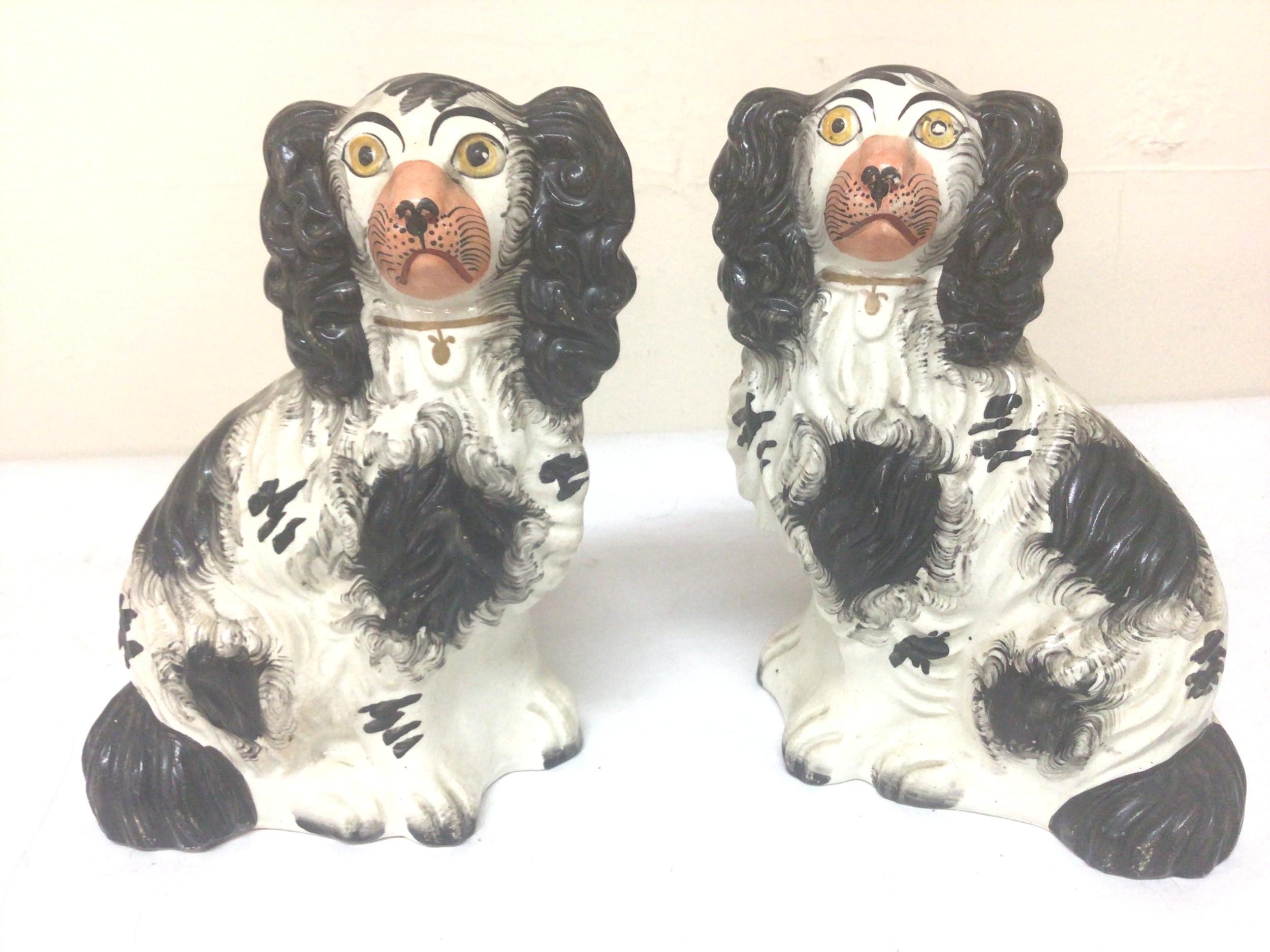  A Pair of Victorian Staffordshire black and white Spaniel dog ornaments Hight 20cm no obvious damage. (2) 