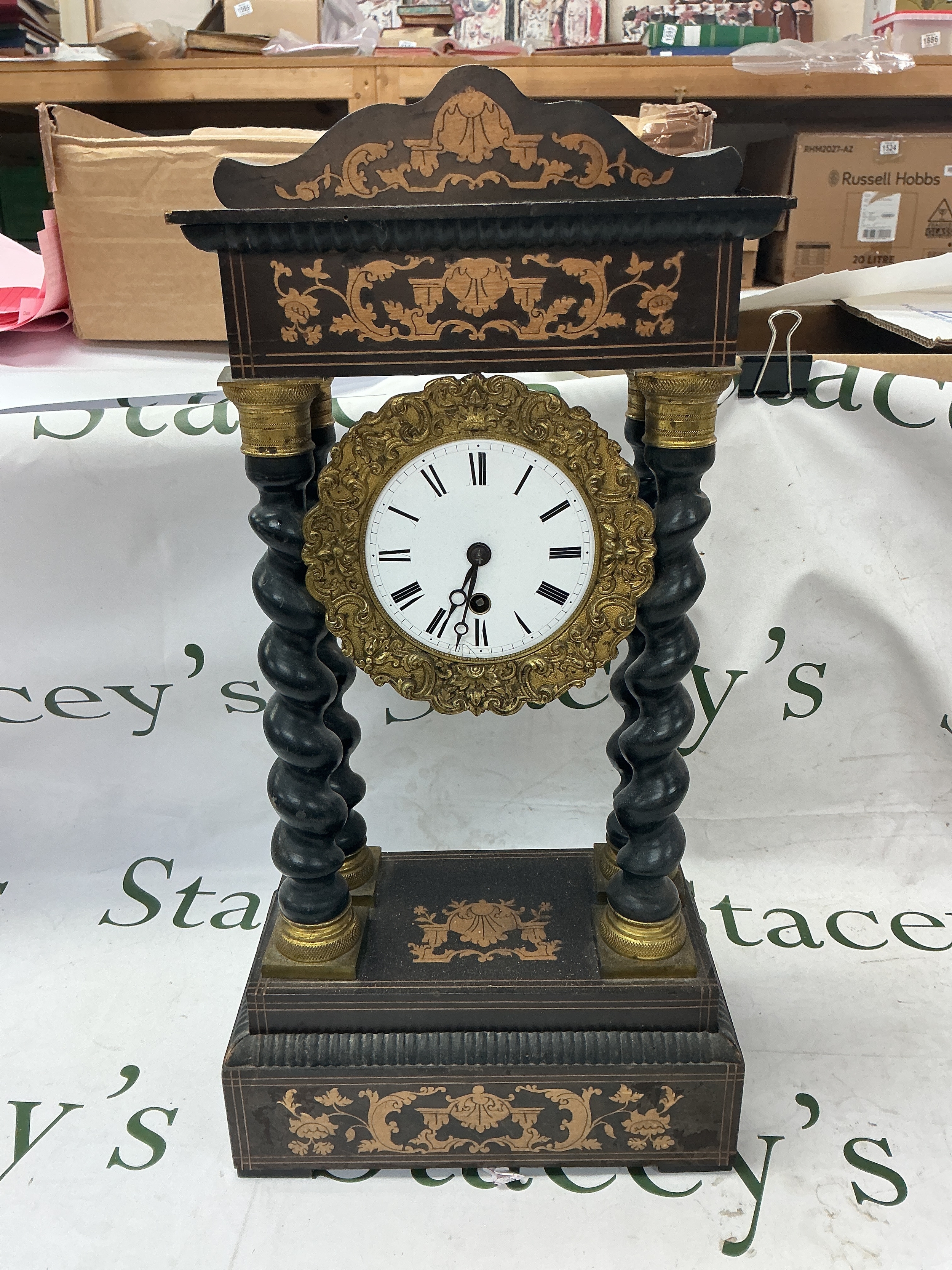 19th-century French ebonised portico mantel clock with barley-twist columns and gilt- brass mounts. 48cm tall
