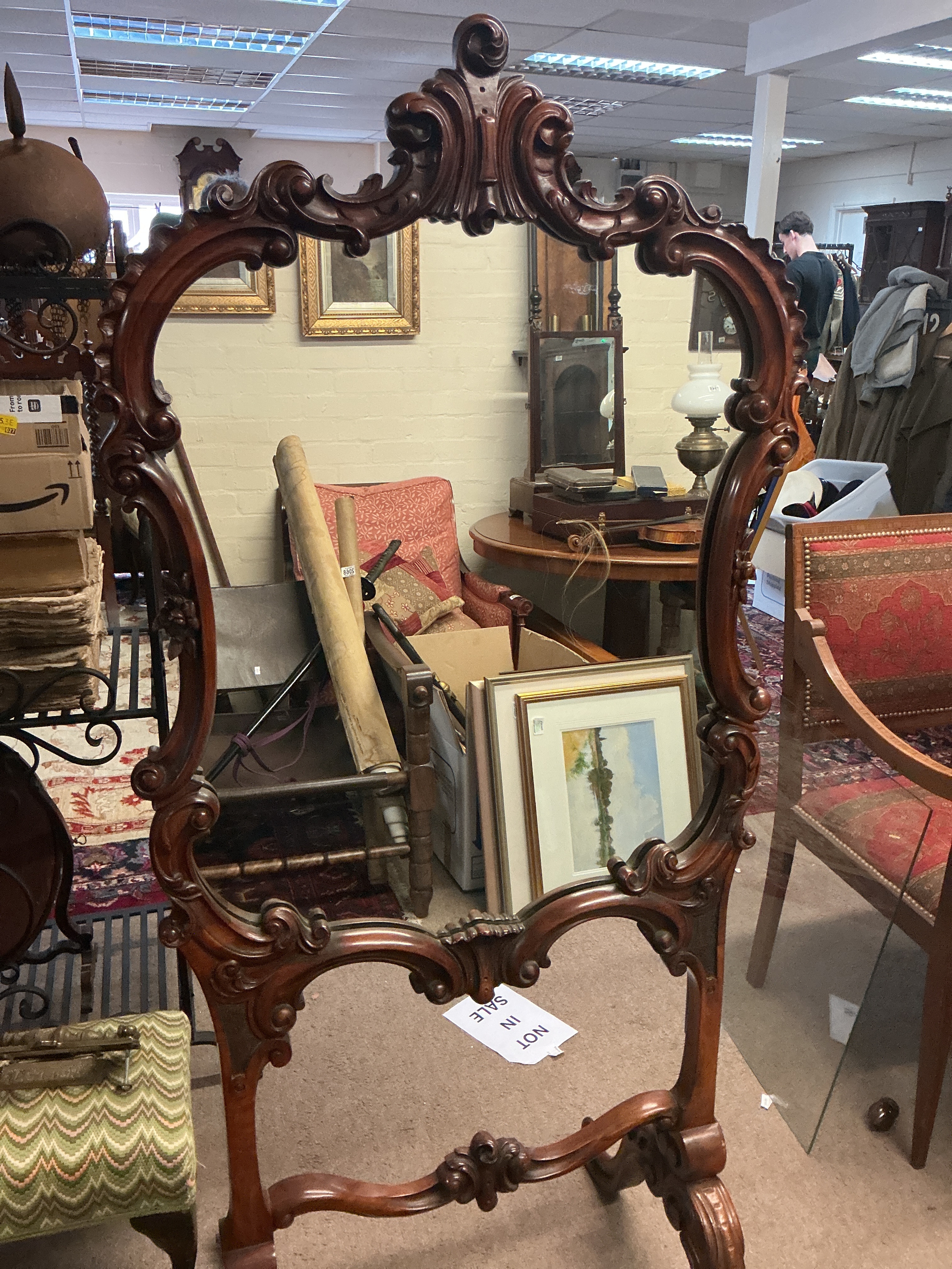 A large mirror with an ornate, hand-carved dark wood frame. 155cm tall 70cm wide 