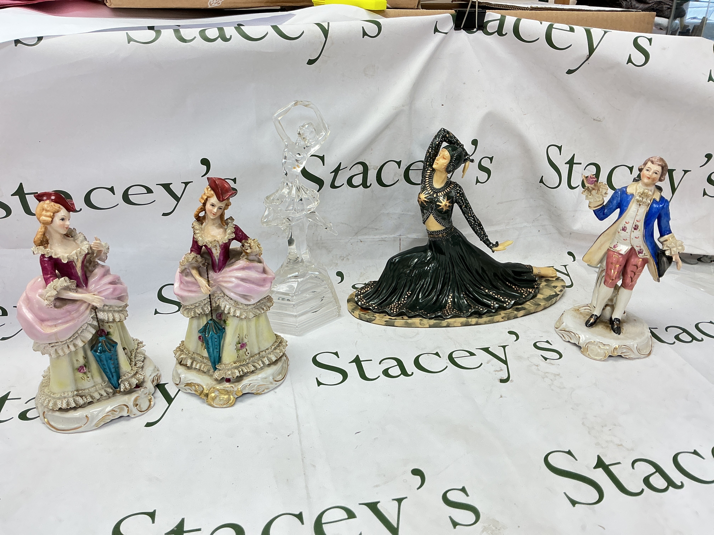A collection of porcelain figures including Victorian style figures, Art deco dancer figure, crystal glass figure (5)