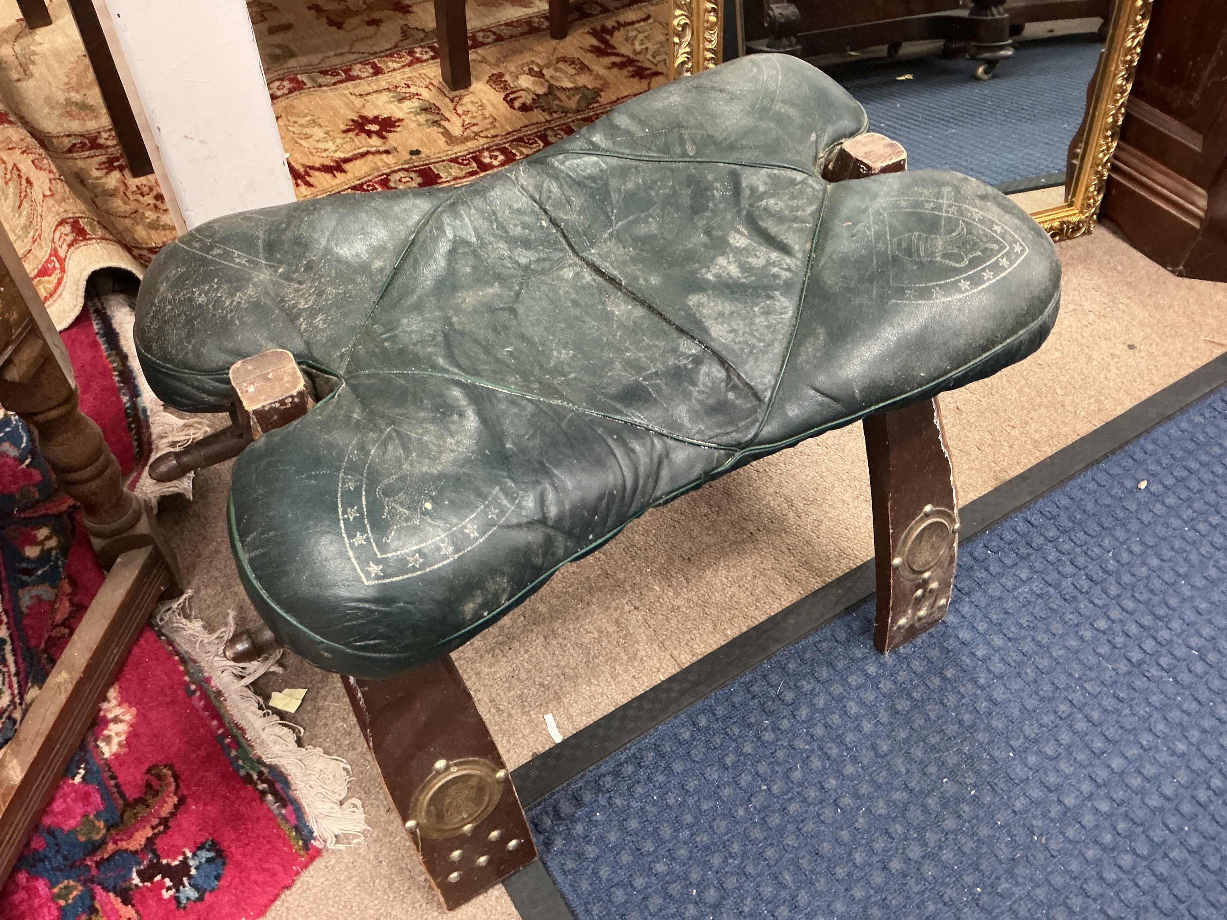 A vintage camel saddle stool. 50cm wide, 35cm tall