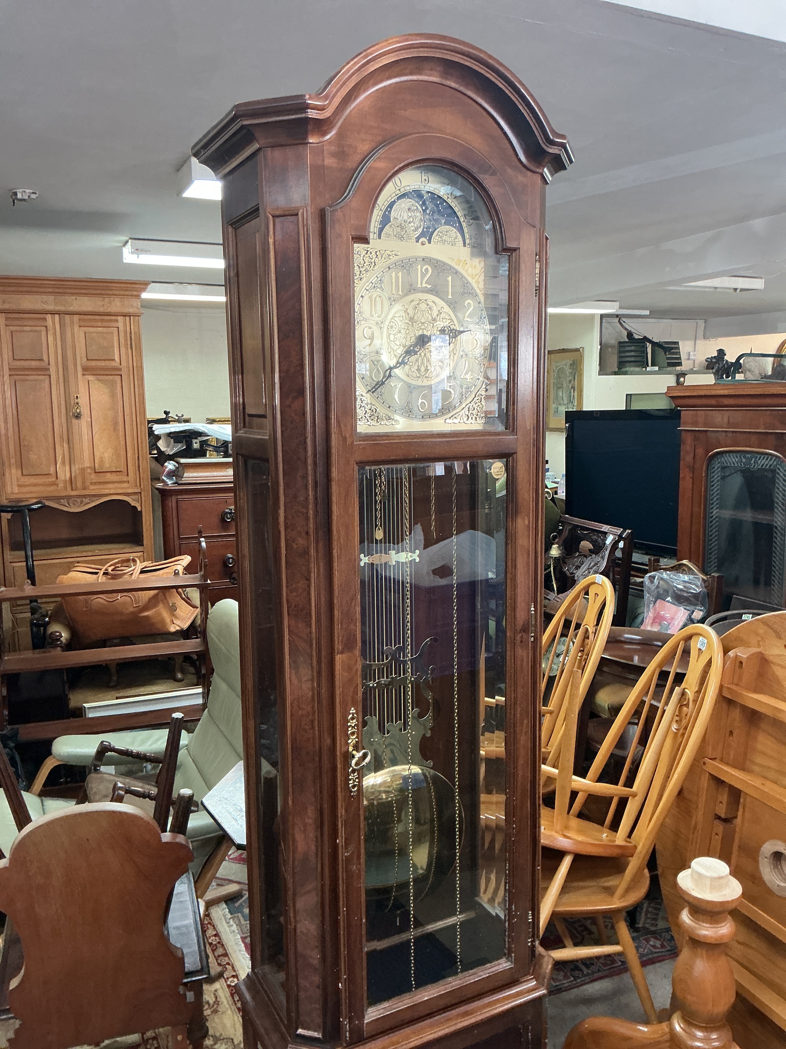 A Walnut Grandfather Clock by Interclock circa 1980s. With pendulum and weights 205cm tall