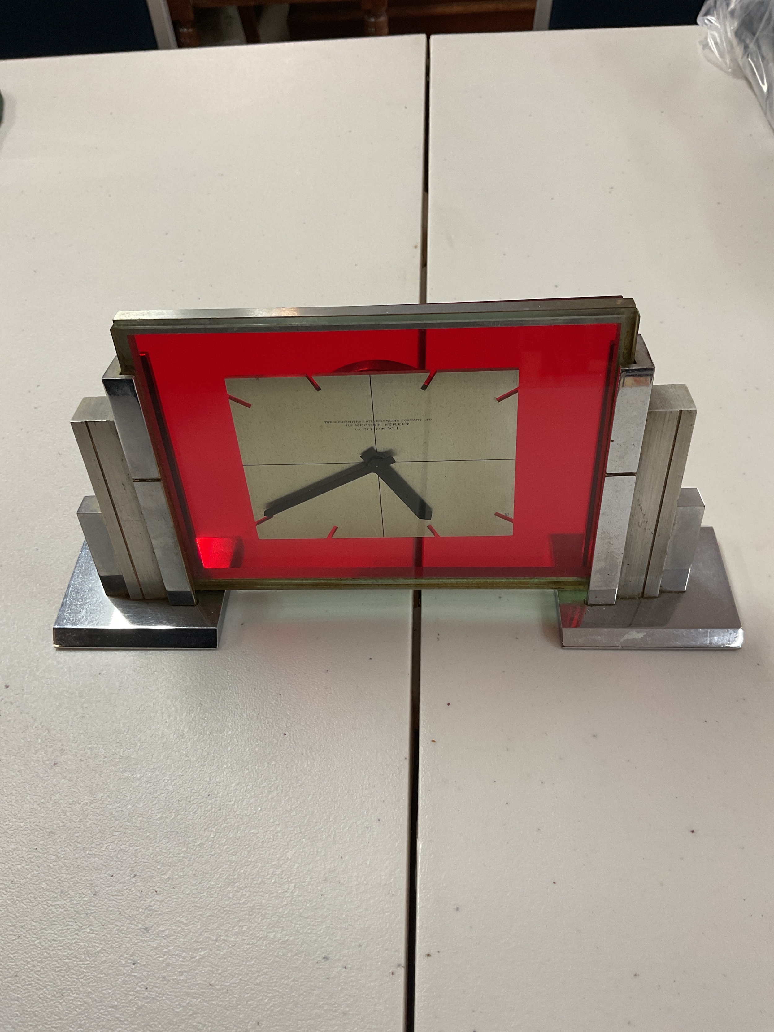 Imhof Art Deco mantle clock in chrome, with glass front signed Goldsmith and Silversmith Co.