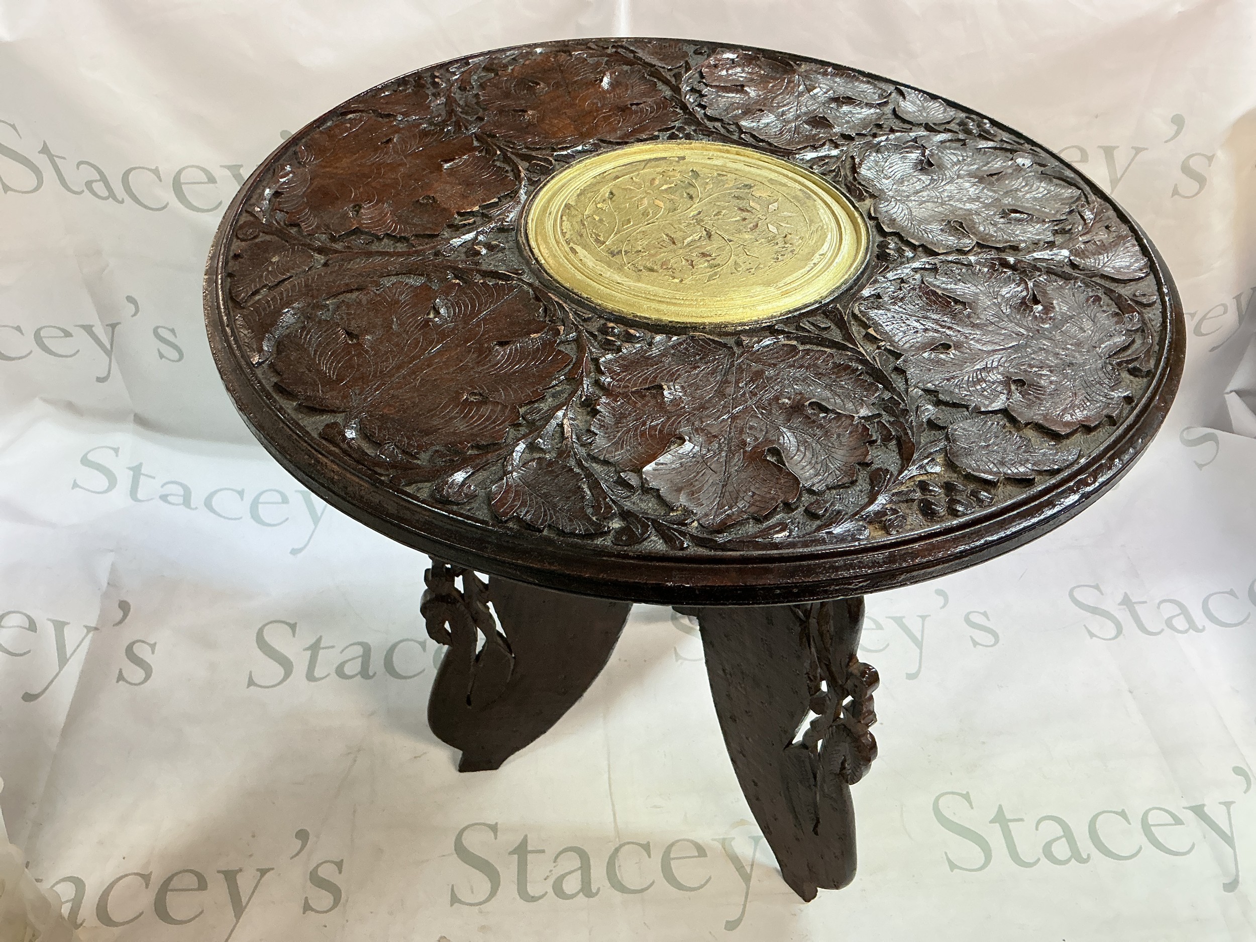 A small carved Indian table.