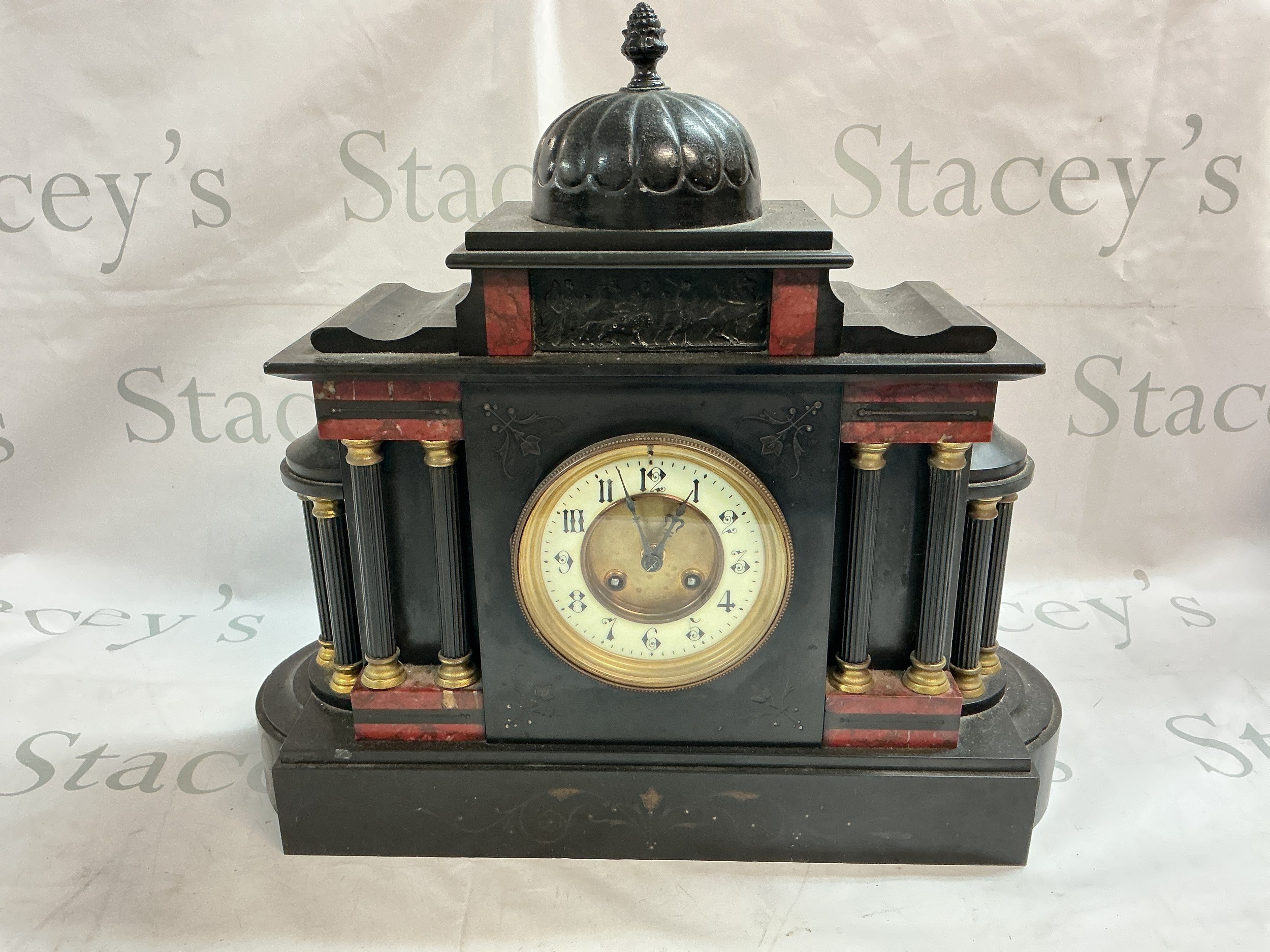 A Victorian black slate Mantel clock with a dome top