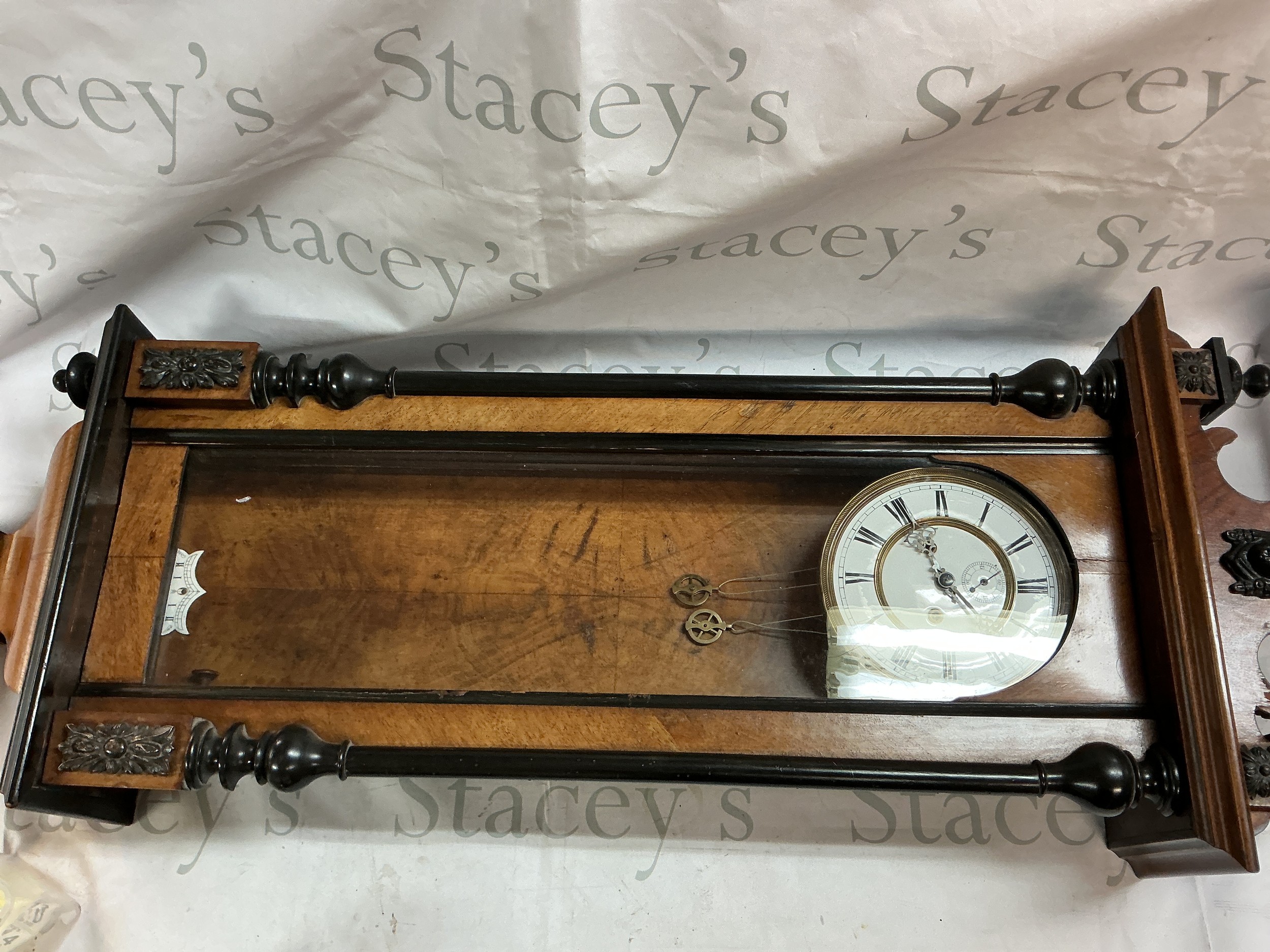 A Two weight Vienna wall clock. 95cm long.