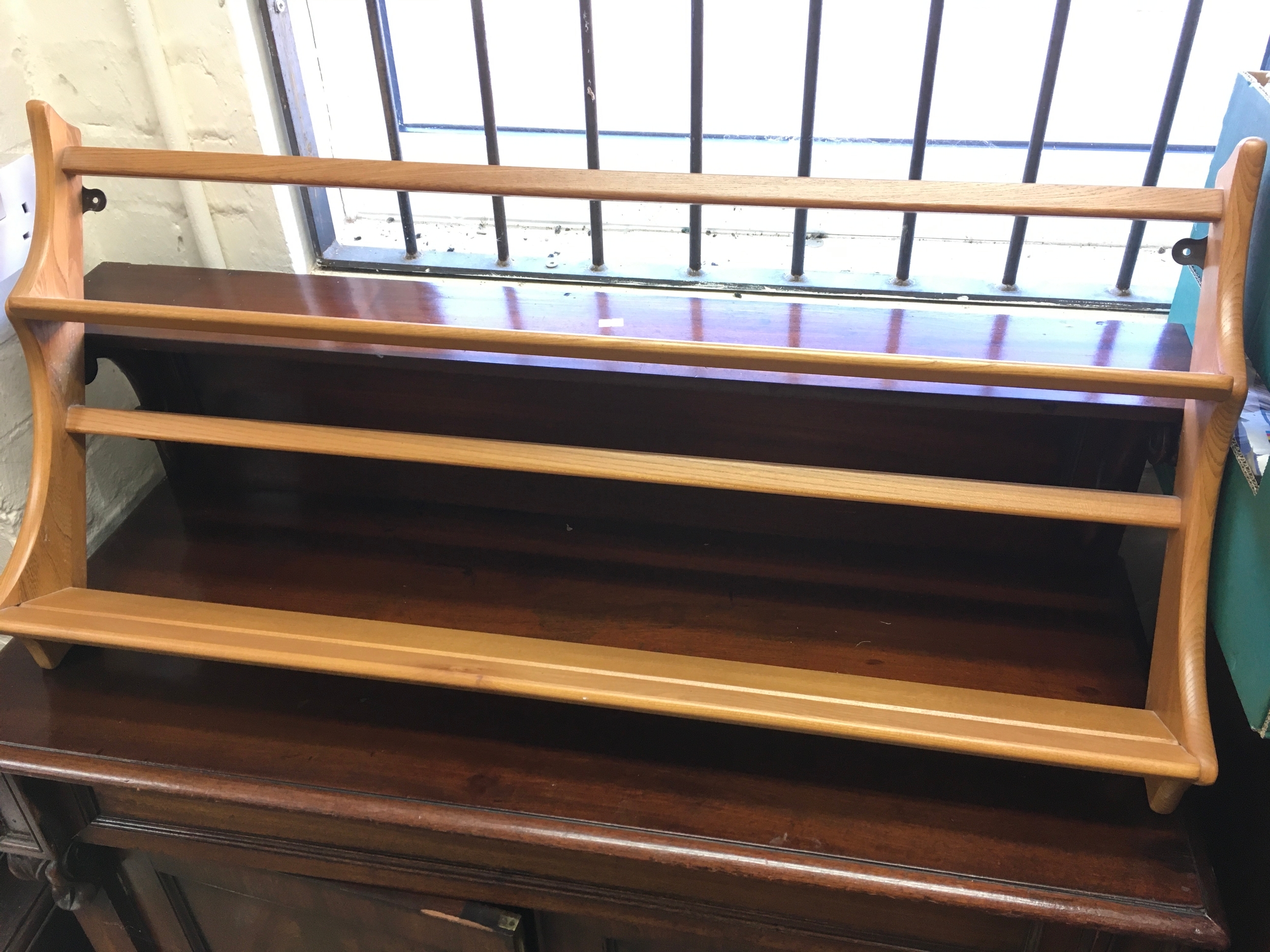 An Ercol plate rack. 38 inches wide.
