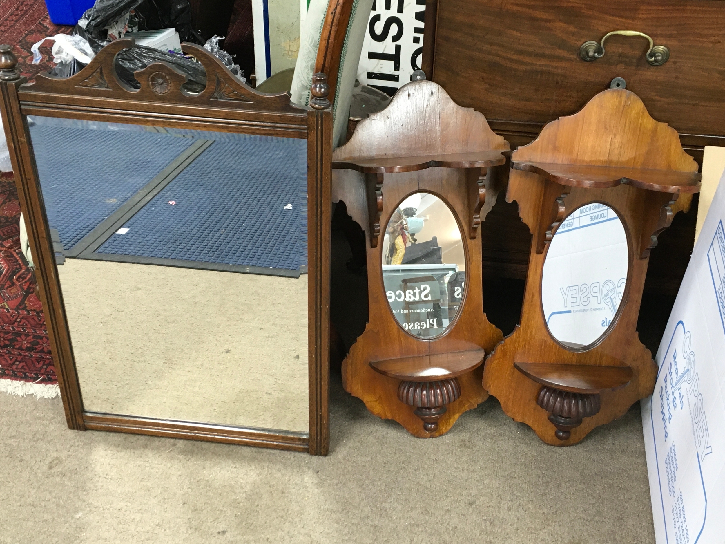 pair of vintage wooden wall-mounted mirror sconces and a wall mirror.