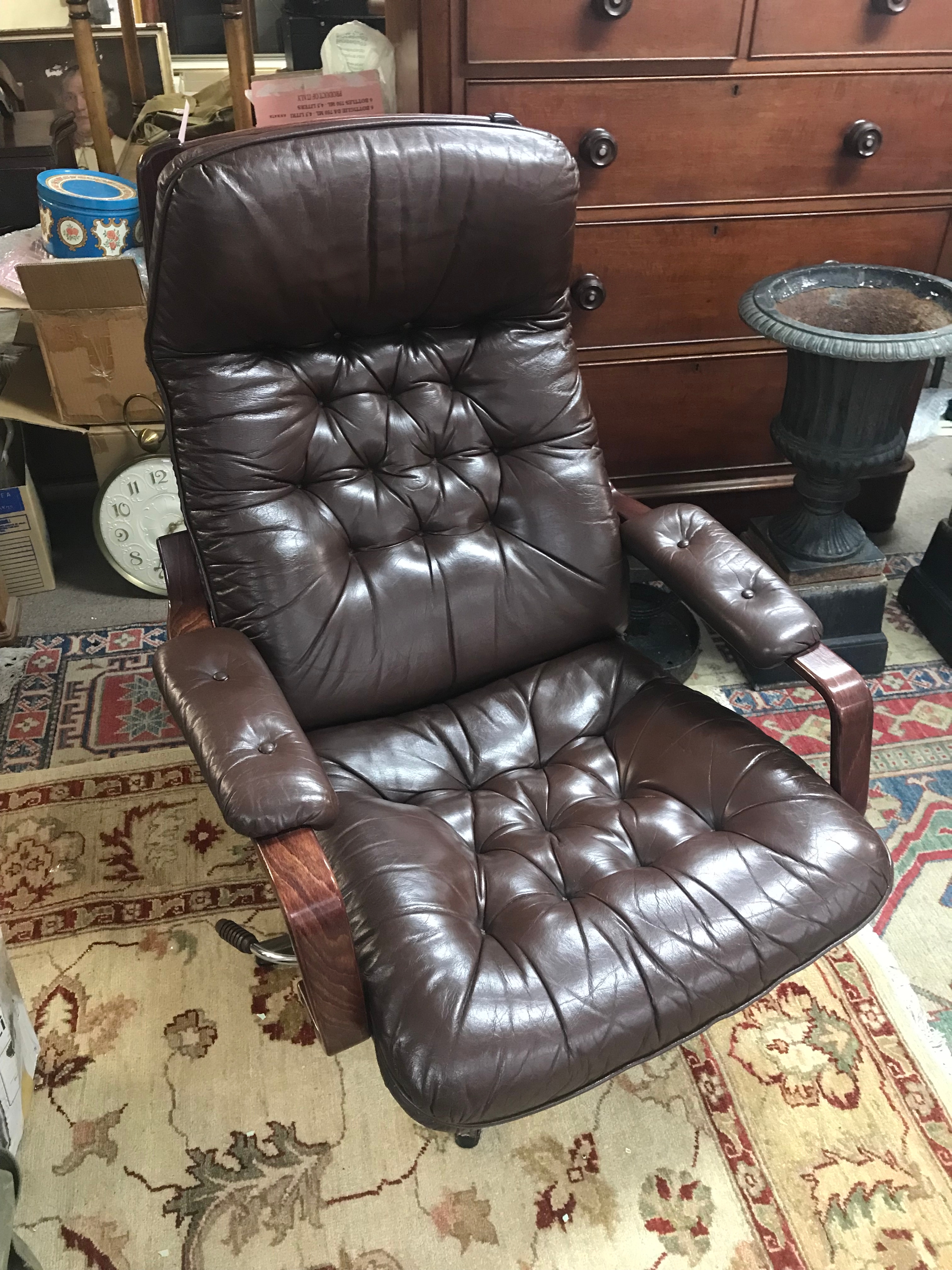 Two vintage mid-century Swedish lounge armchairs in brown leather