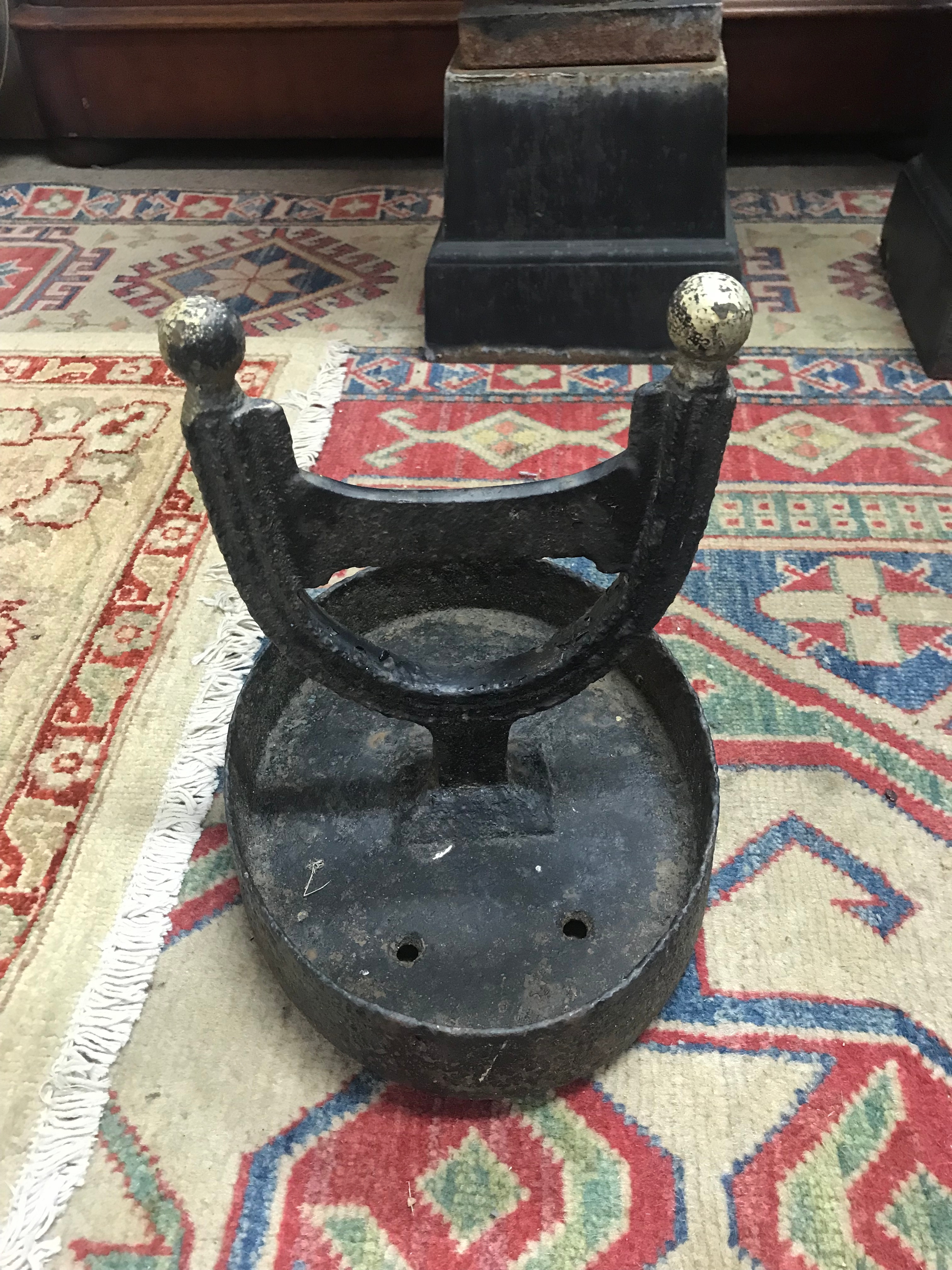 Two cast iron foot scrapers