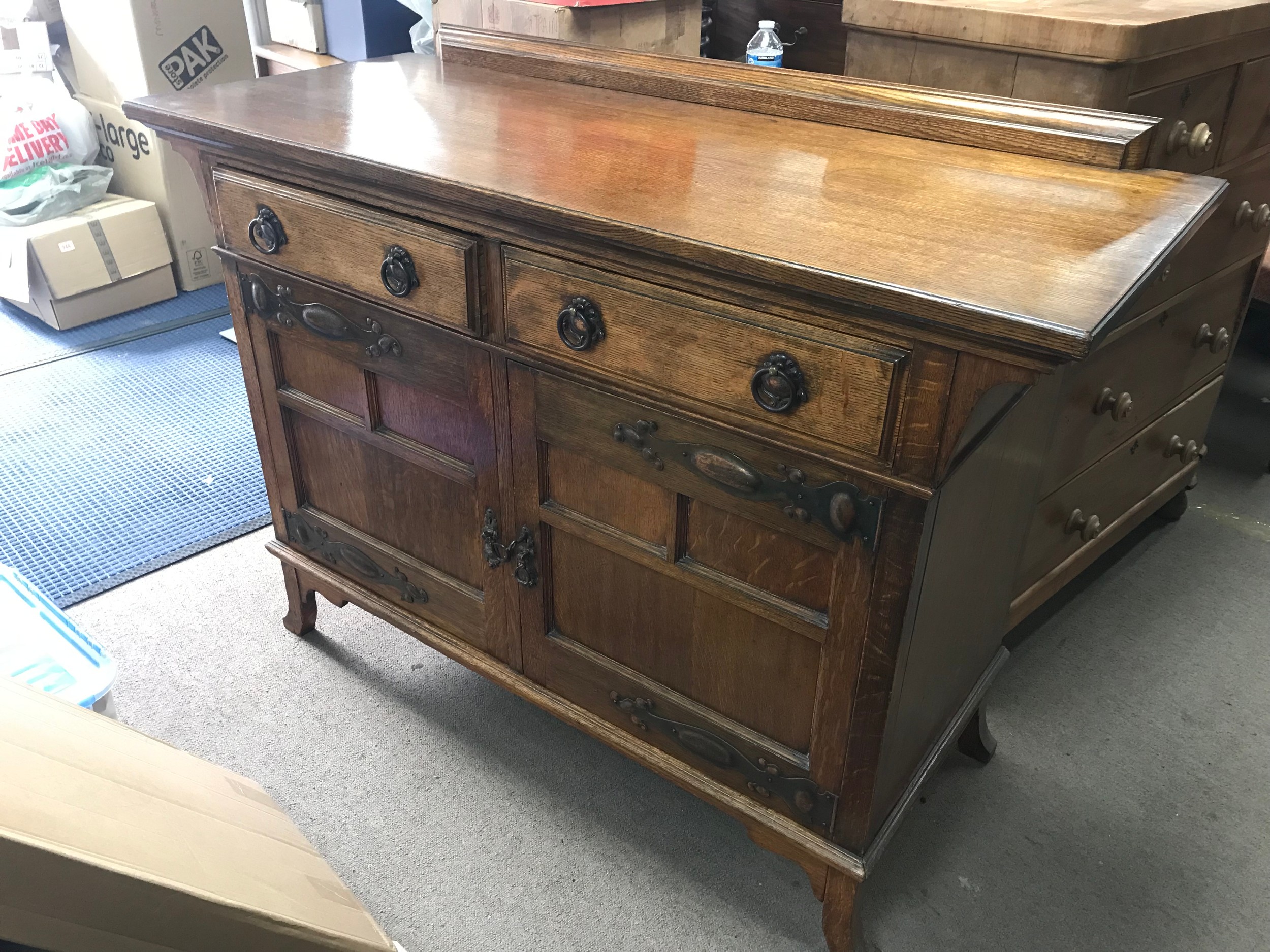 An Arts and Crafts sideboard 57cm long, 138cm wide, 102cm tall
