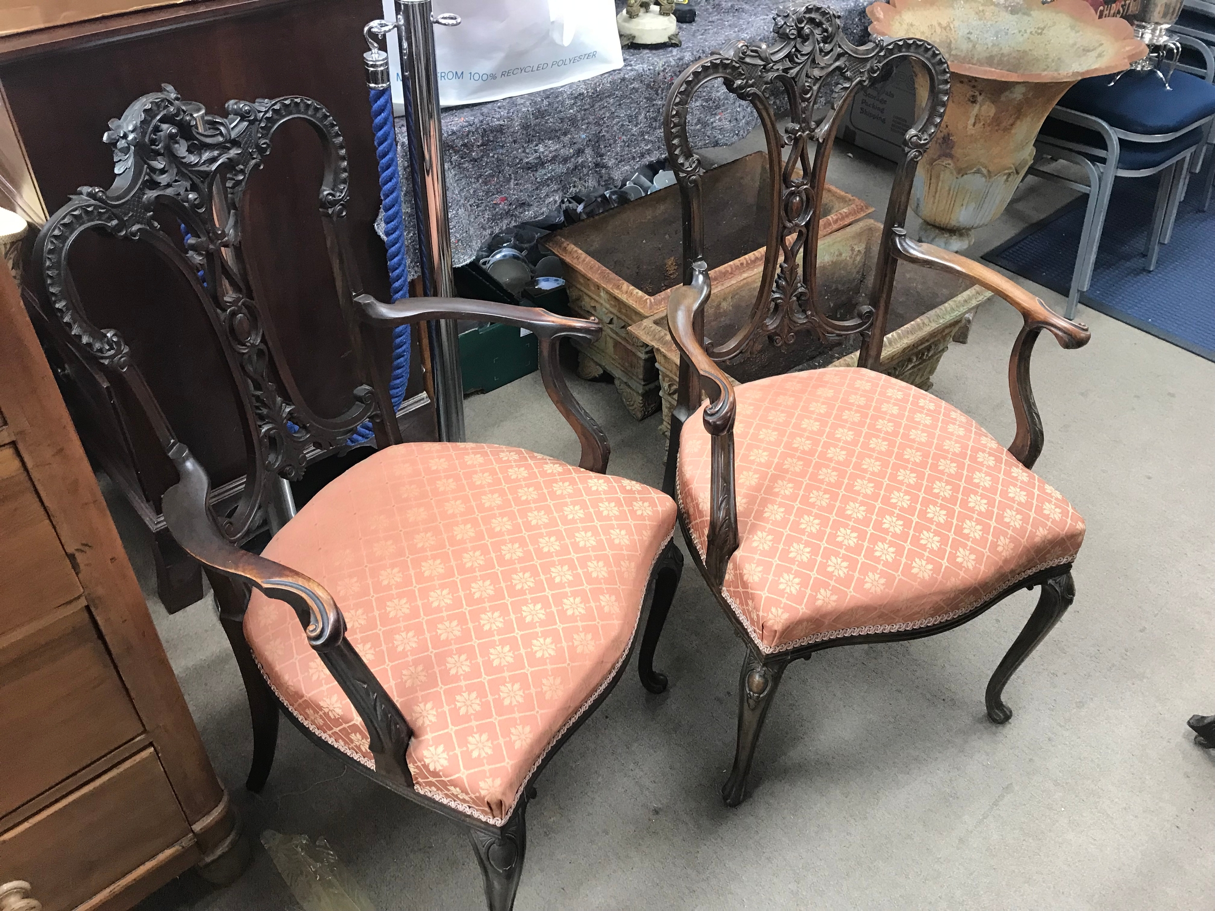 Two 19th century mahogany armchairs featuring a intricate pierced splat back and classic cabriole legs. 62cm wide 102cm tall 48cm long
