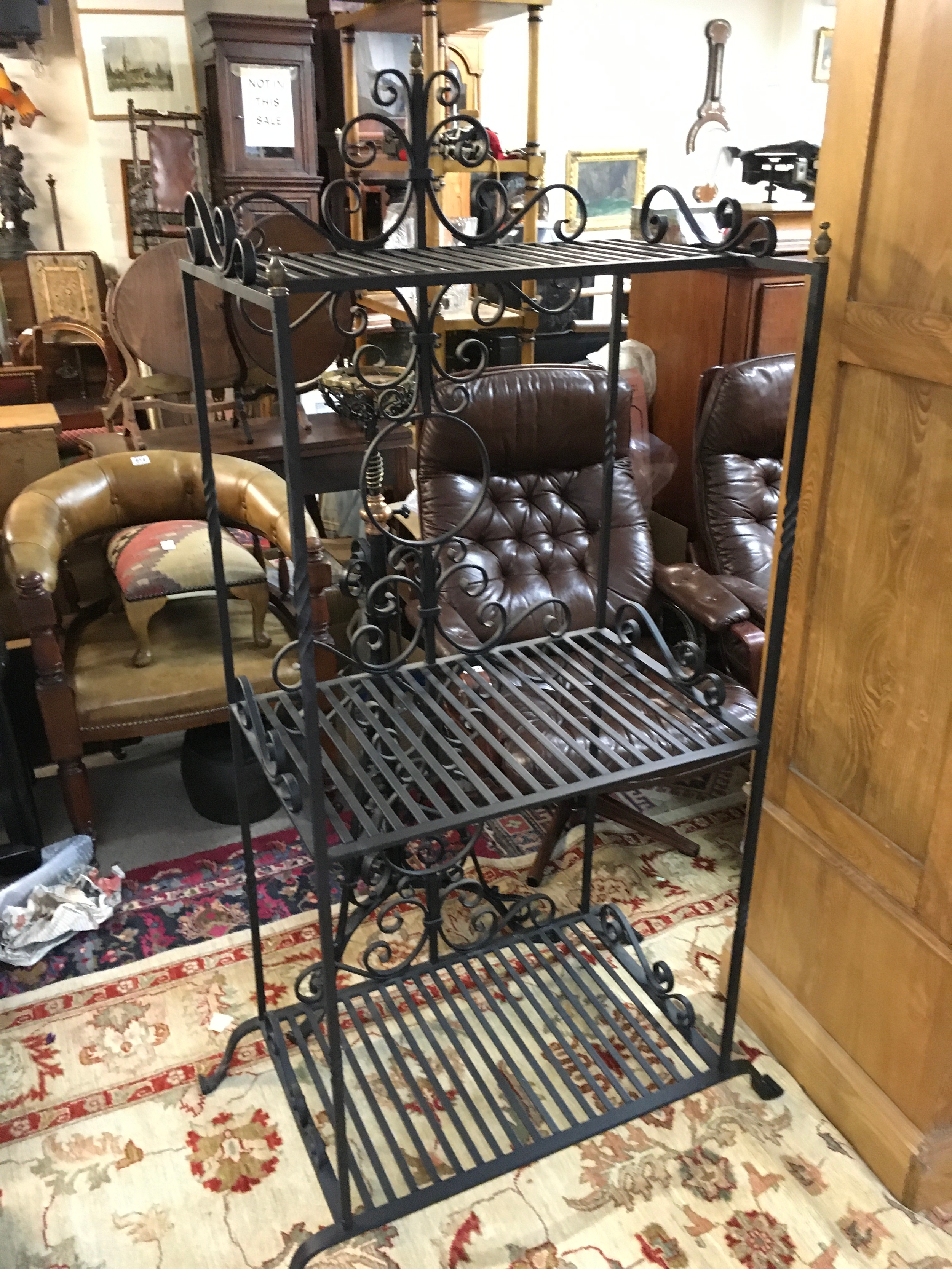 A wrought iron stand and one other stand. 156 and 112cm tall