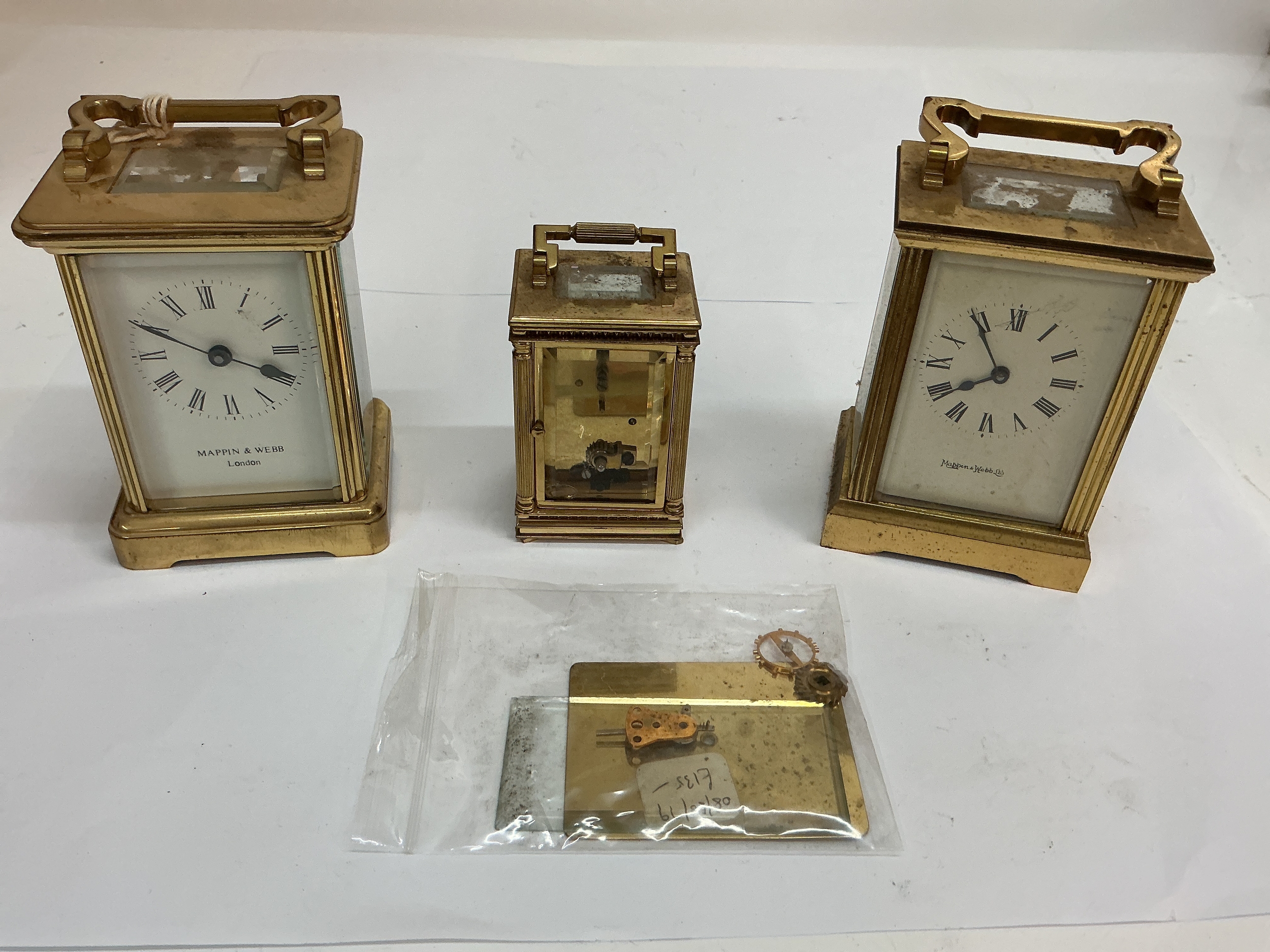 Two Mappin & Webb brass carriage clocks plus another smaller example. All offered for spares or repair.