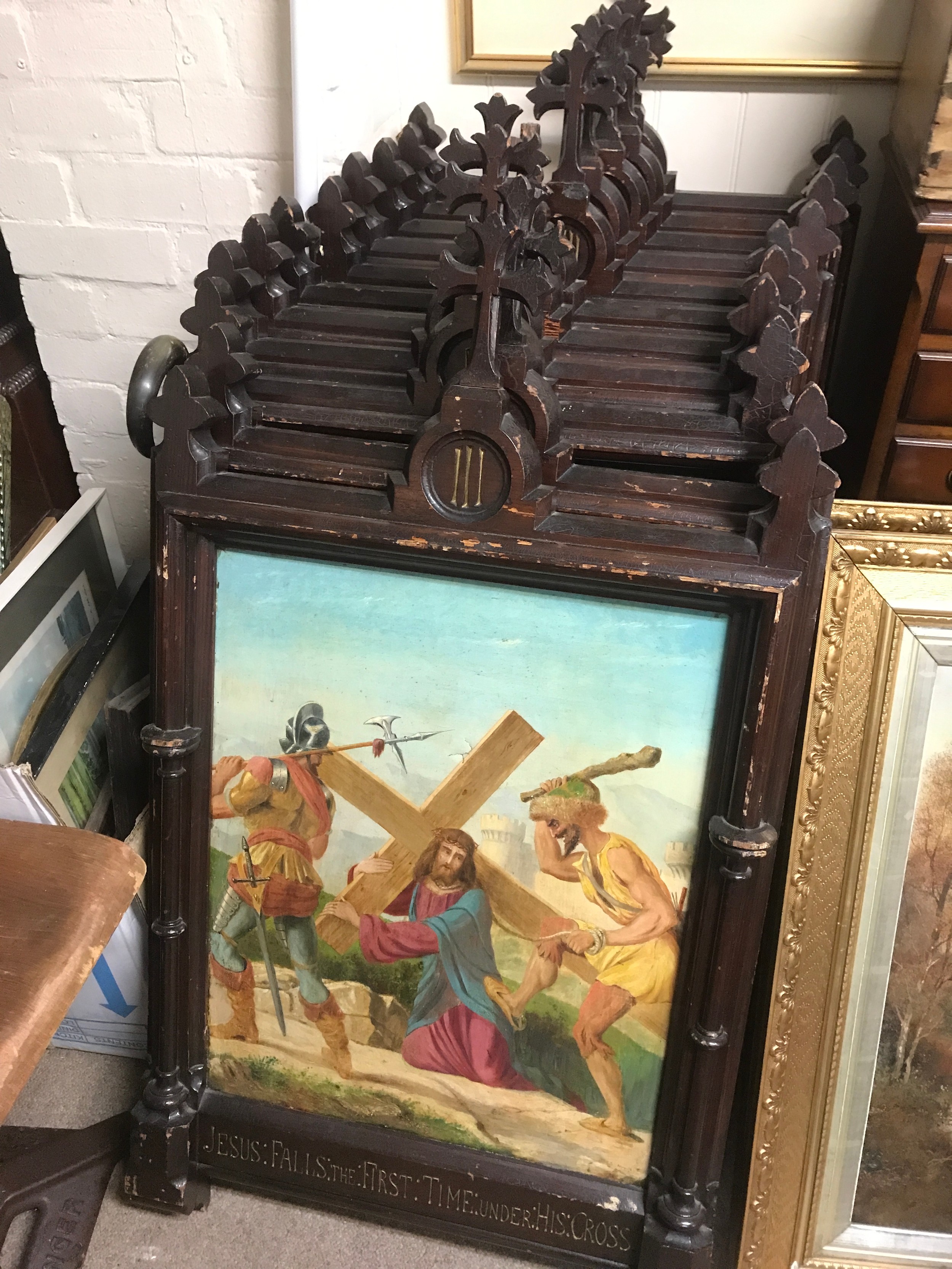 A set of eleven Religious pictures a Cycle of stations of the cross sacred images 19th century, in  Carved dark wood frames with Gothic-style pinnacle crosses. Some damage.