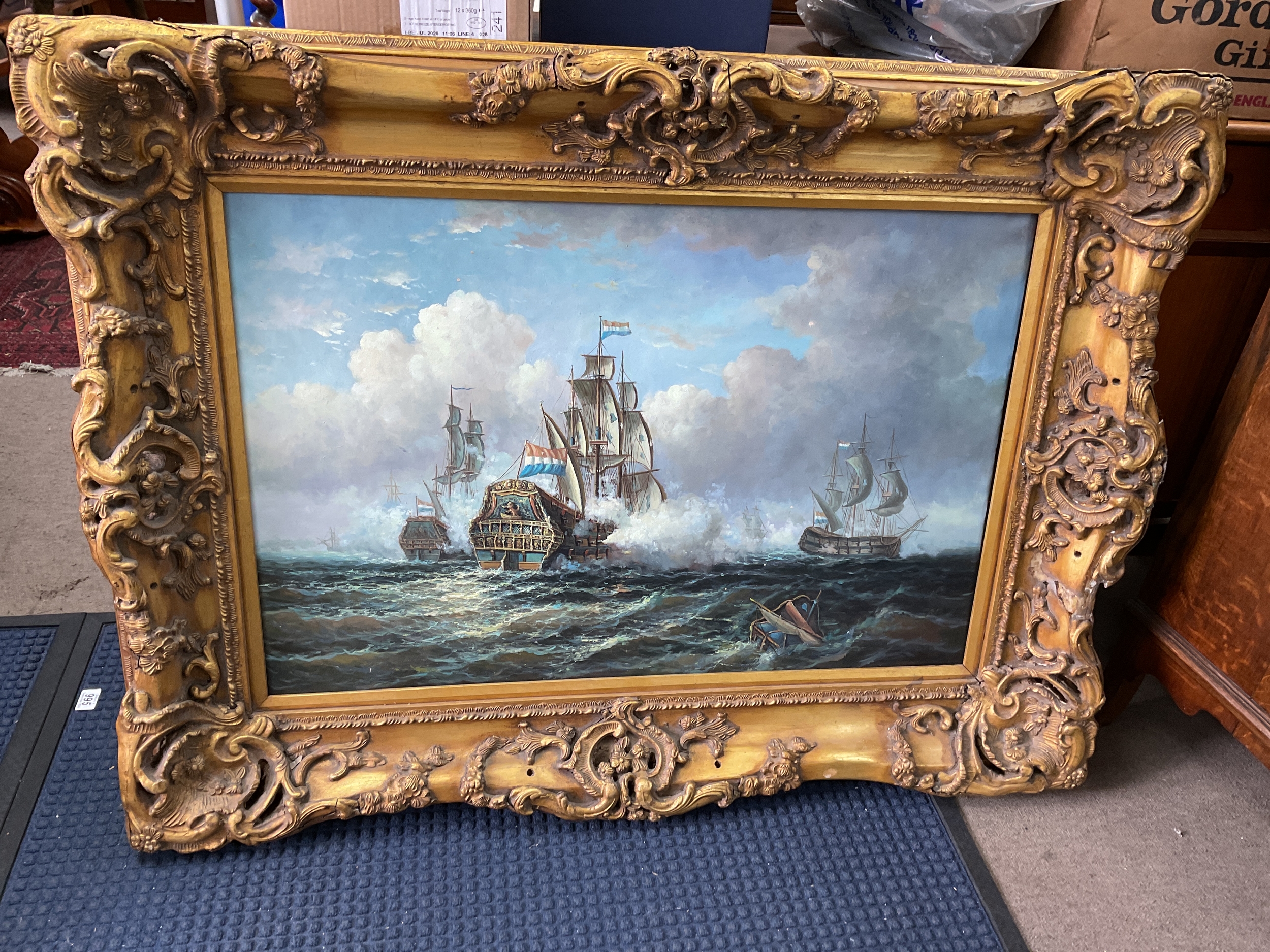 Large gilt framed oil on canvas of Dutch man of wars with holed sails. 92cm x 122cm.