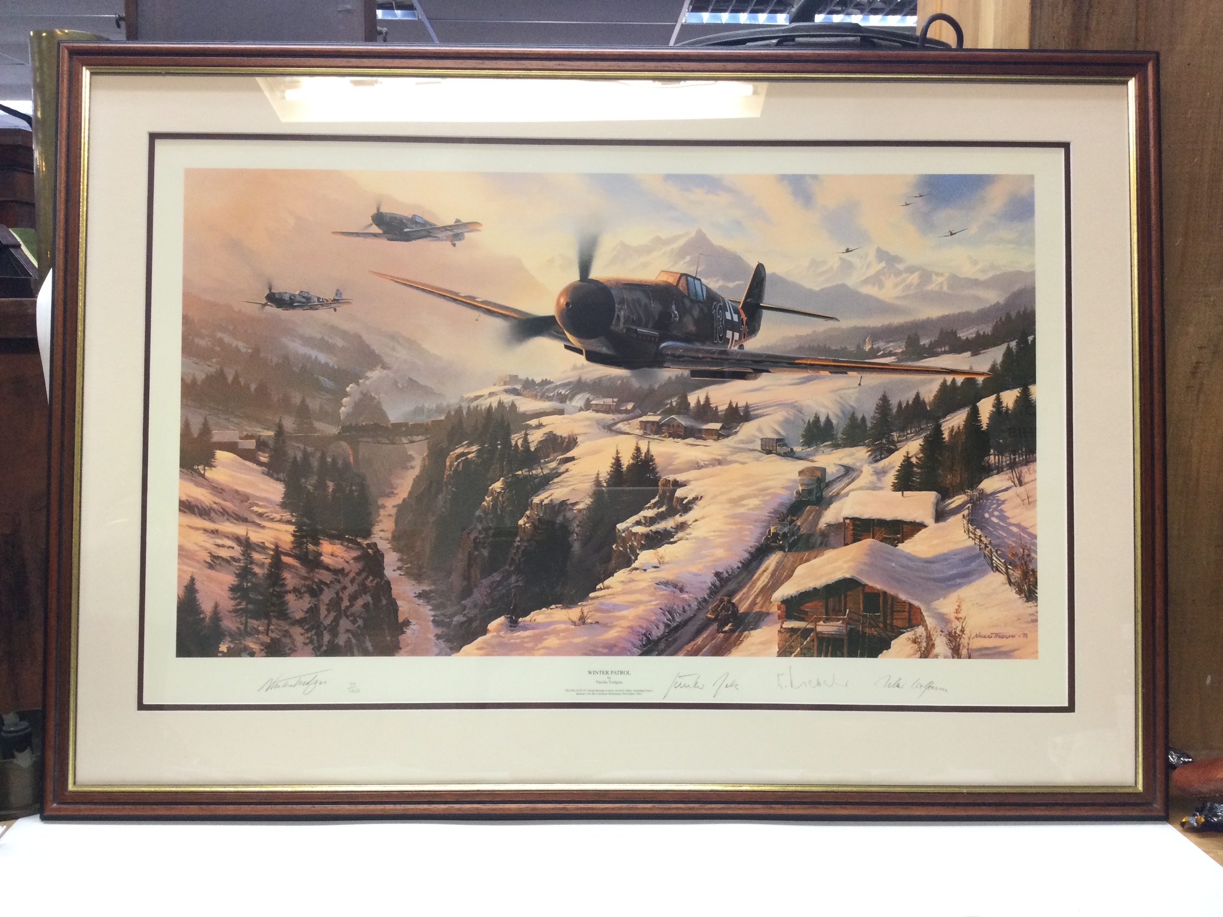 A print signed Winter Patrol by Nicolas Trudgian 77/1250. Height 27.5cm, Width 39cm.