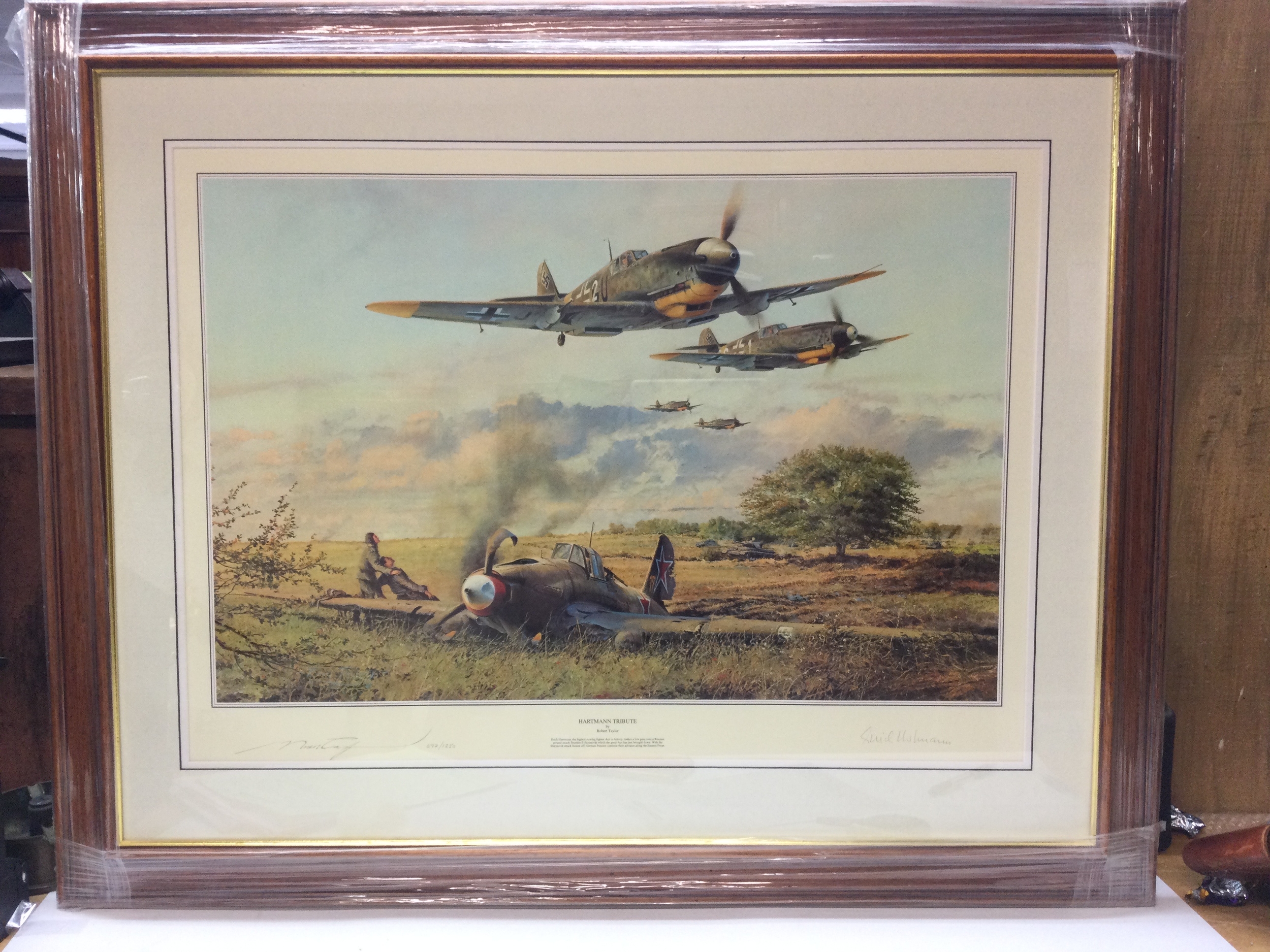 A print signed Hartmann Tribute by Robert Taylor. 697/1250. Height 30.5cm, Width 38cm. 
