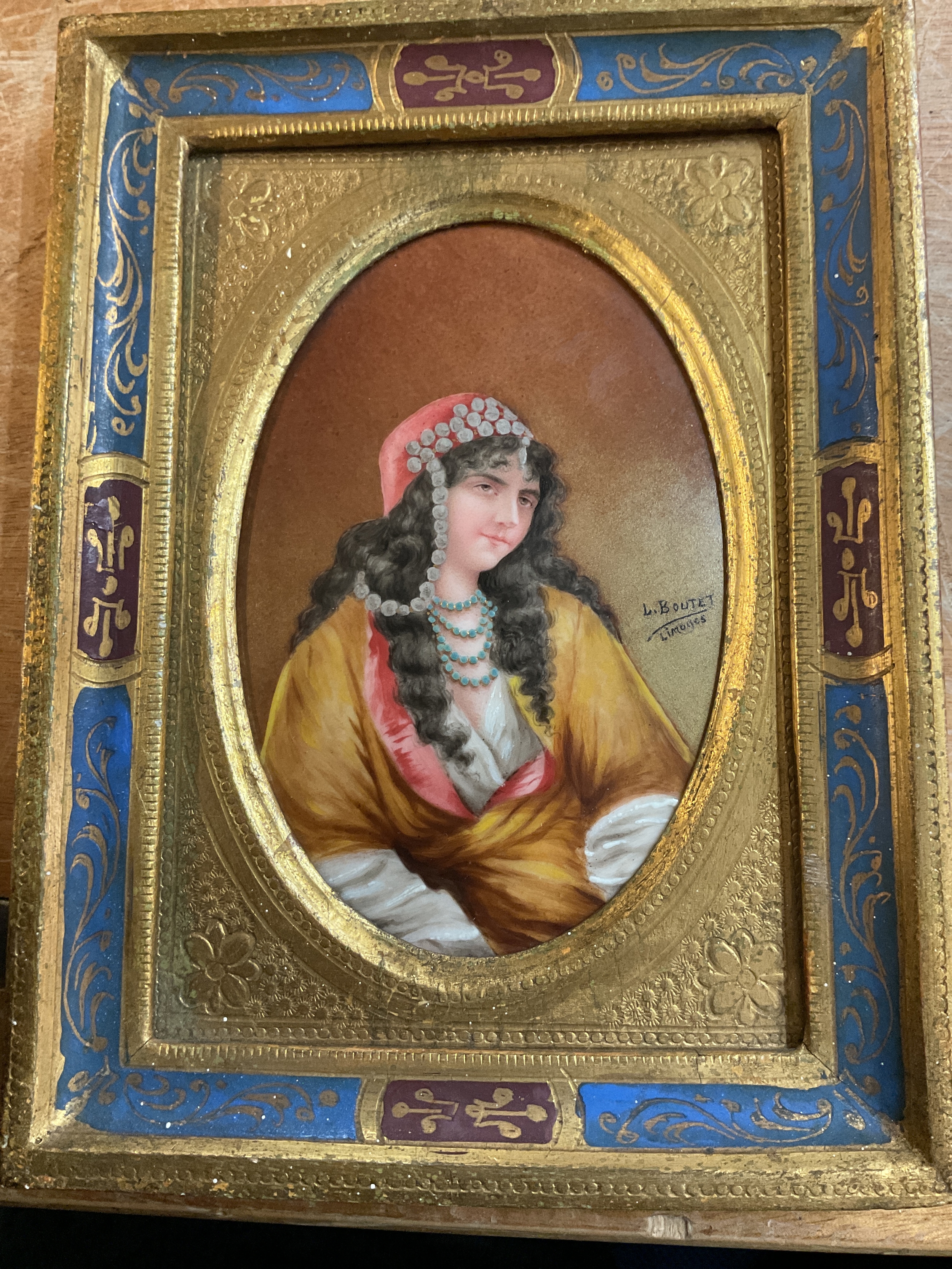 L Boutet miniature portrait for Limoges of a Middle Eastern Woman painted onto tile/glass in ornate frame, H 12 cm x 8 cm.
