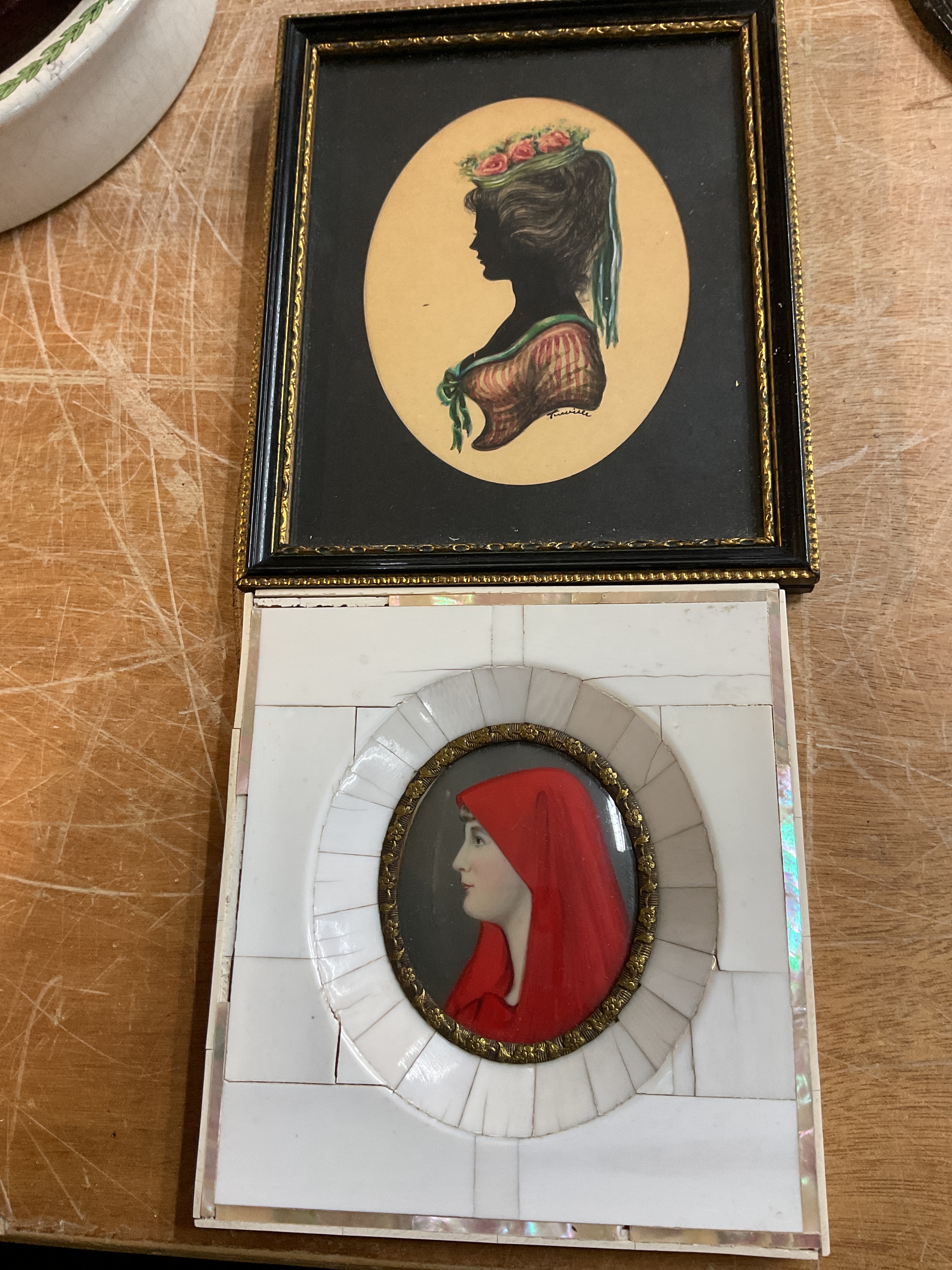 Framed Silhouette with coloured bodice and hat signed Turville, along with framed miniature painting of woman in red hood.