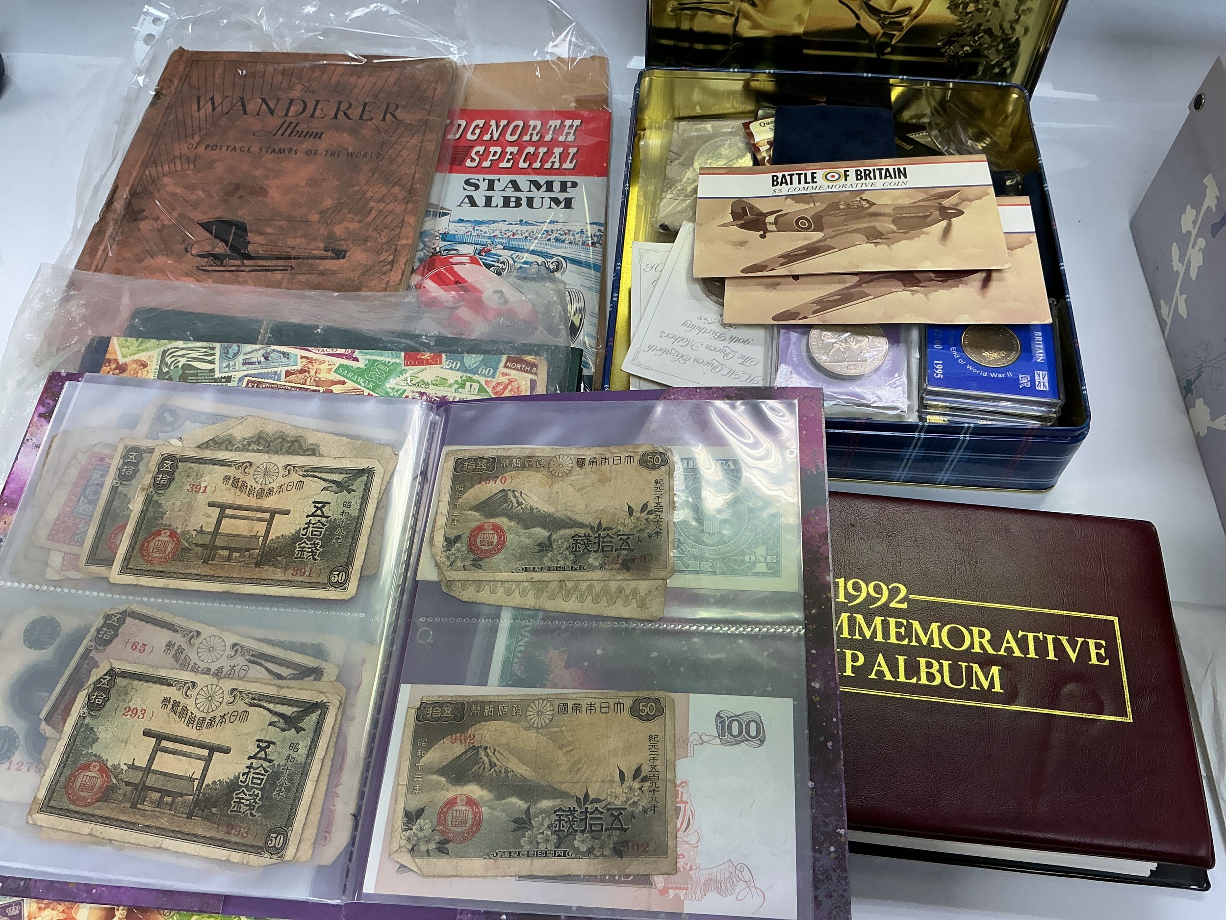 A box of stamps, first day covers, coins etc.