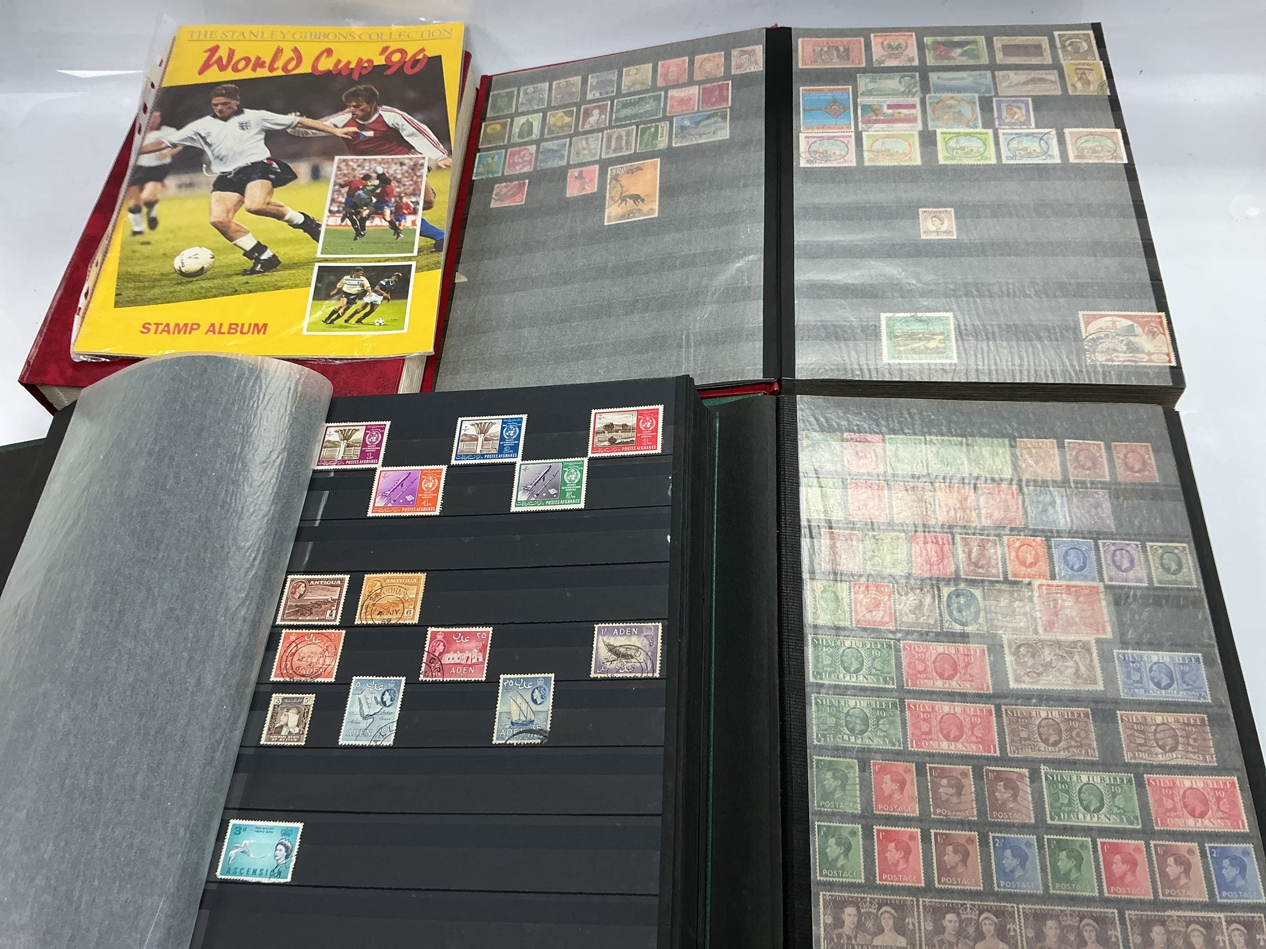 A collection of GB and world stamps in binders.