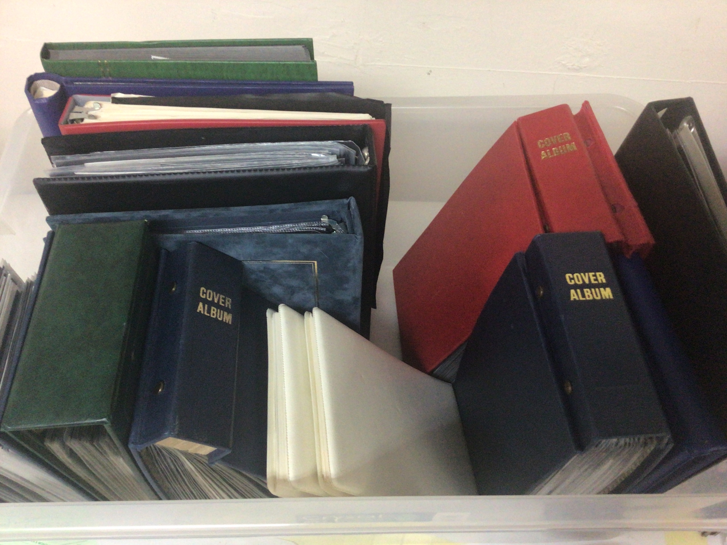  A box containing a mixed lot of stamp albums and first day covers World stamps and unused British decimal pictorial stamps. 