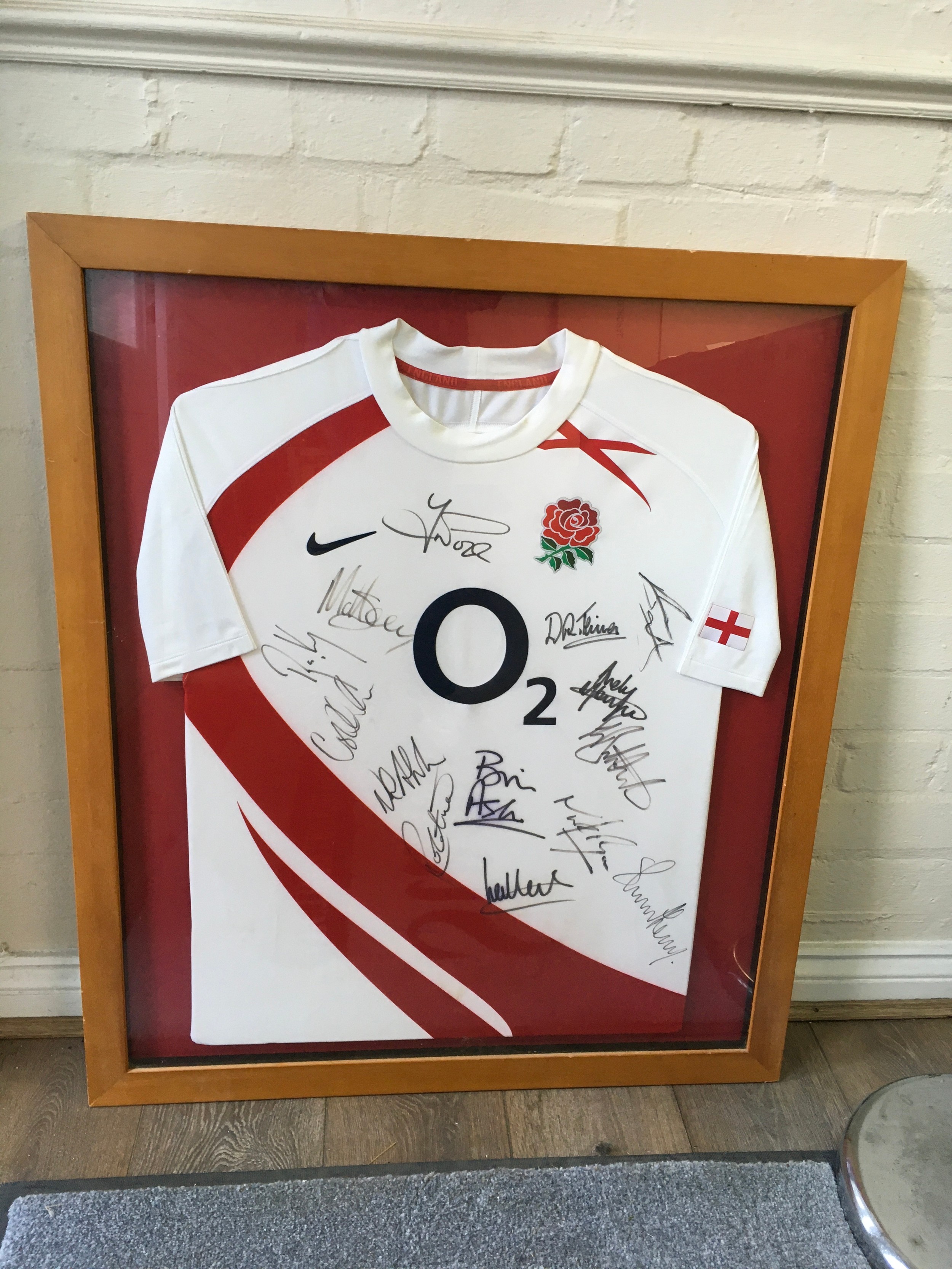 A framed England 2007 World Cup Rugby squad multi signed shirt, with certificate. Approx W76x H90cm.
