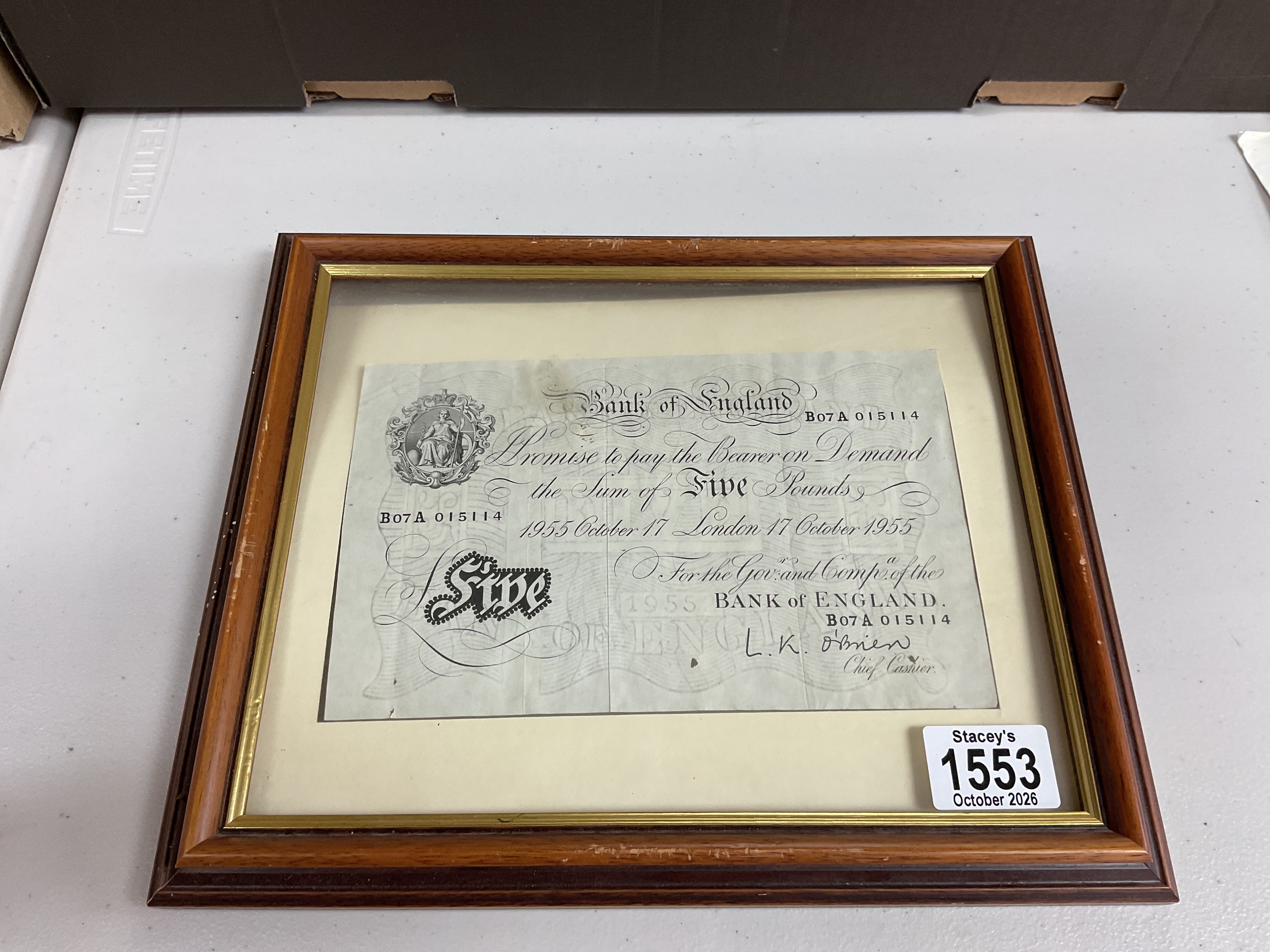 Framed and glazed 1955 L K OBrien white fiver.