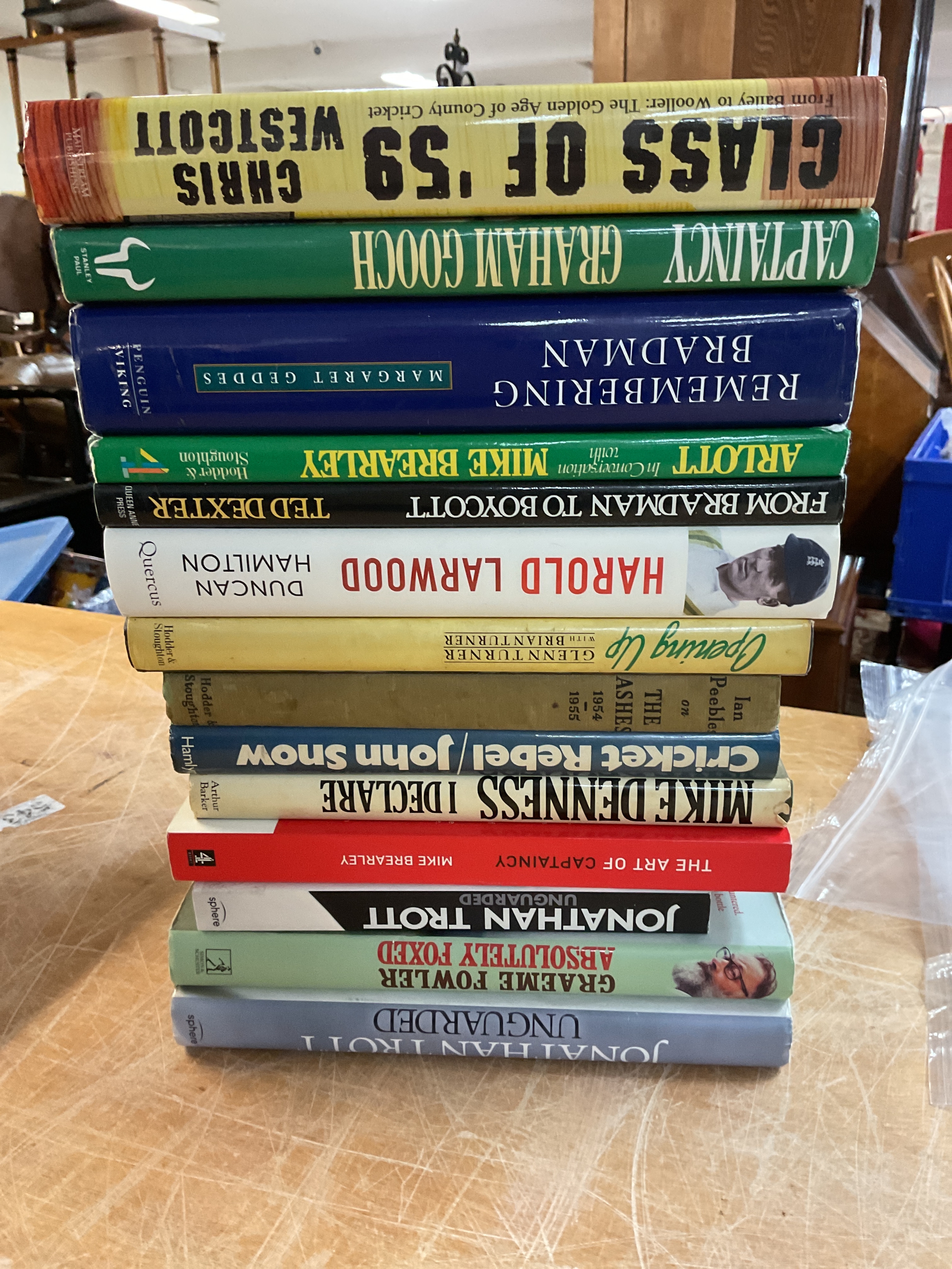 Cricket books to include signed Graham Gooch example.