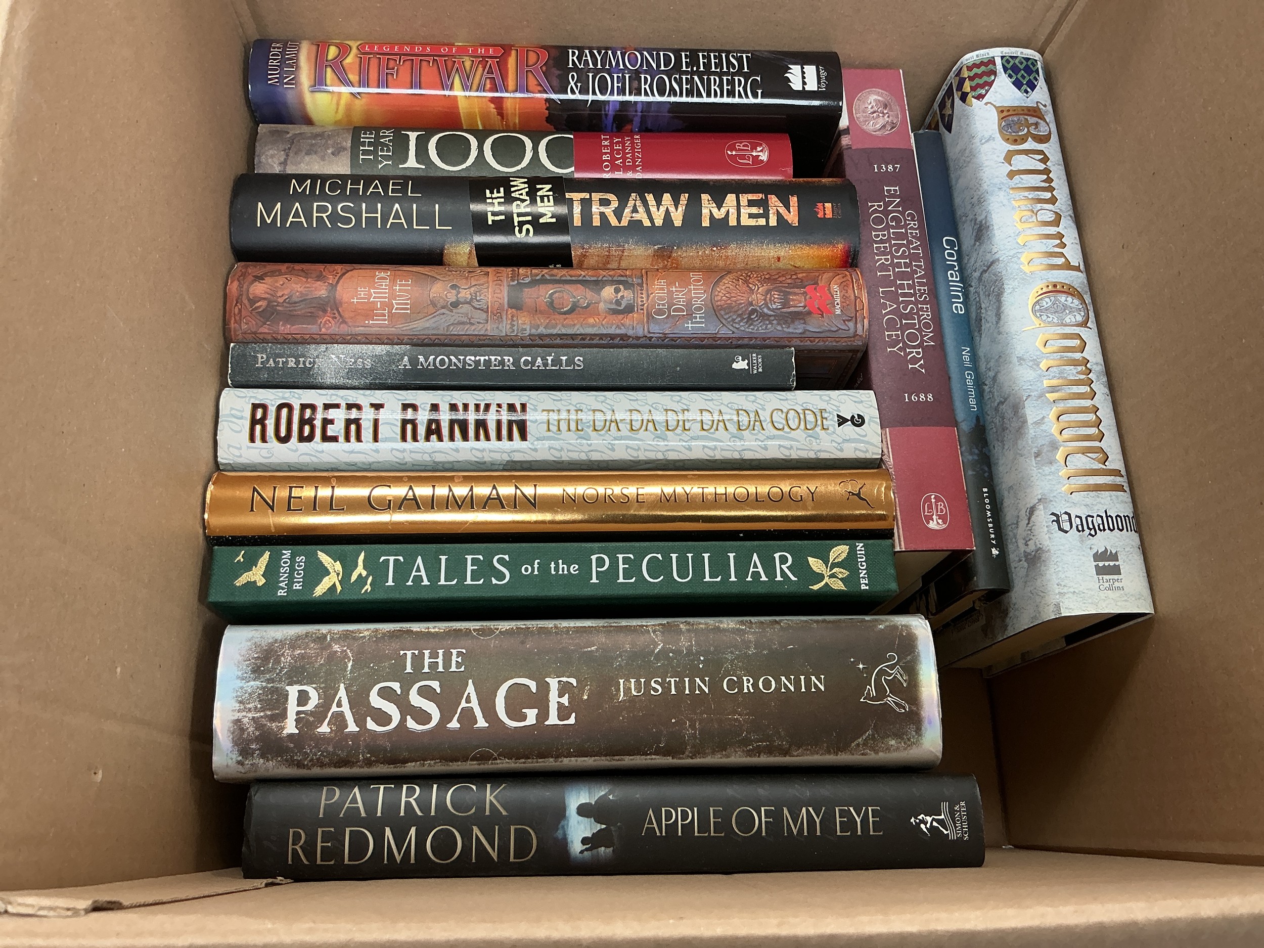 A box of signed hardback fictional novels by various authors including Bernard Cornwell, Mark Gatiss, Neil Gaiman and many more.