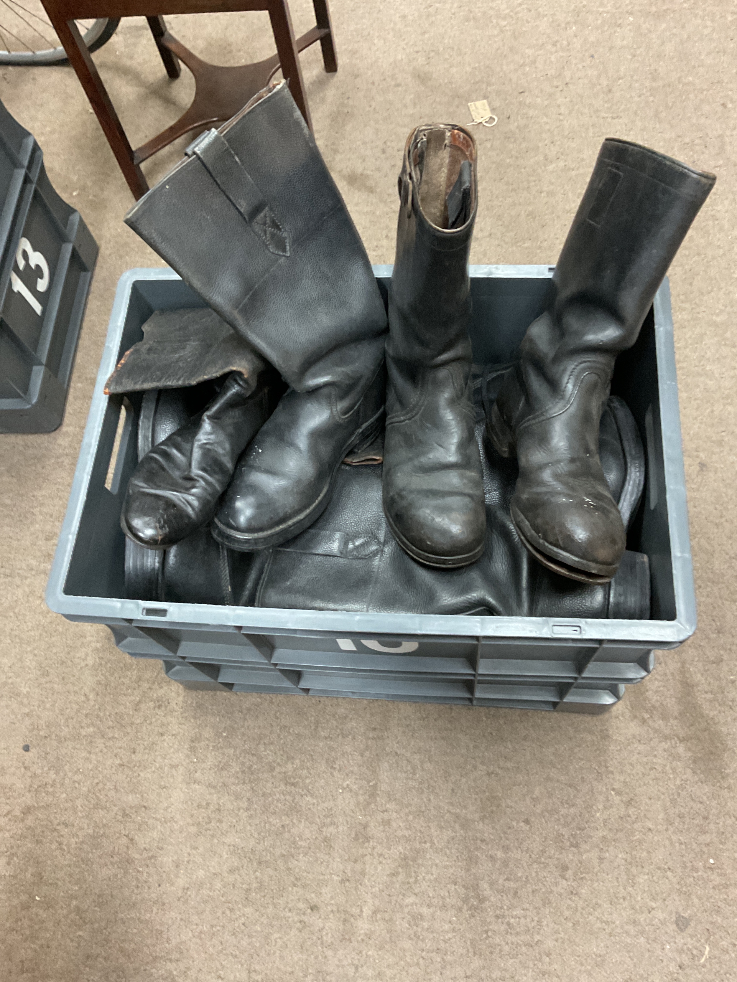 Crate of military black boots.