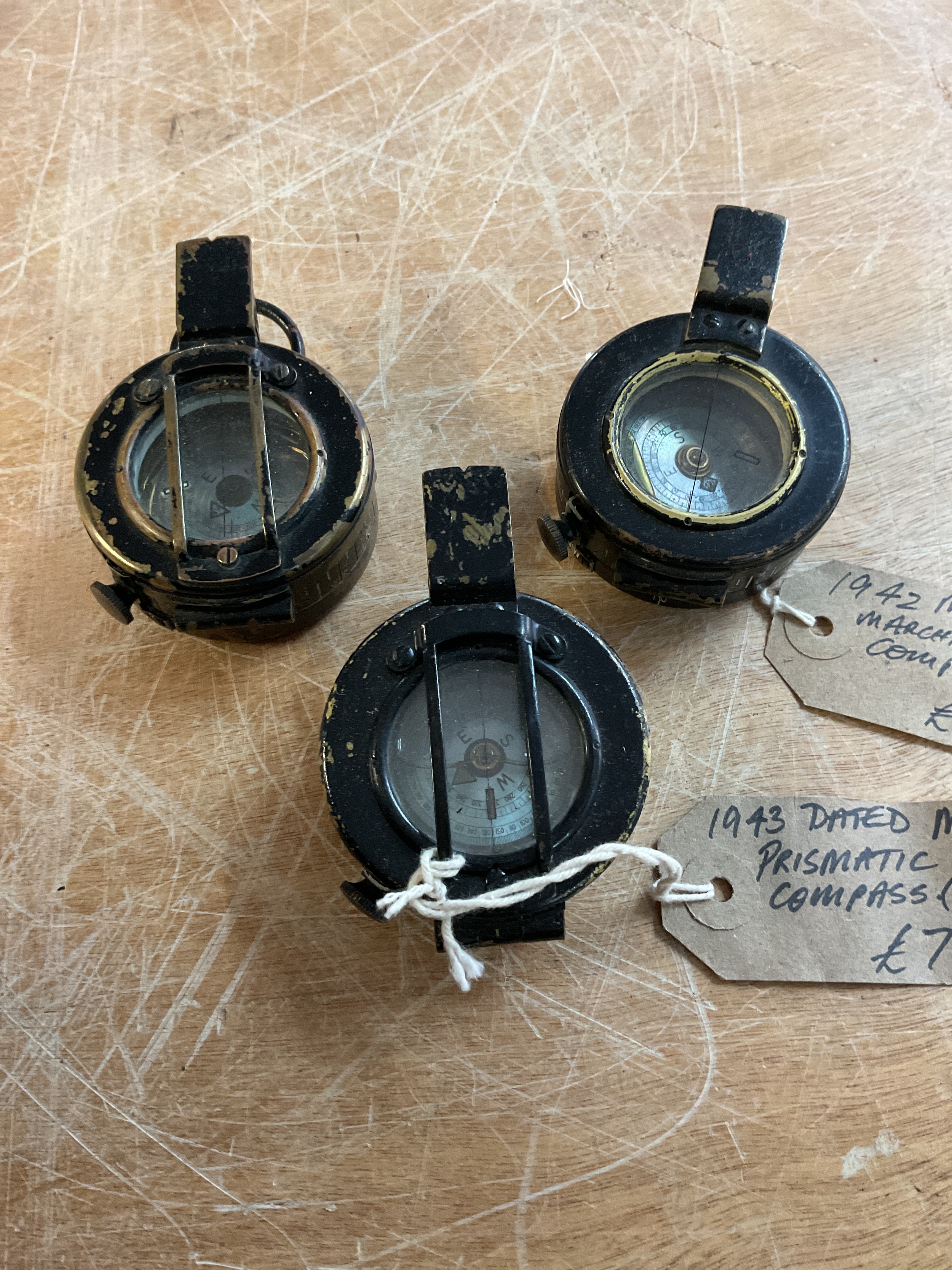 Three WWII Marching compasses with Mother of Pearl dials.