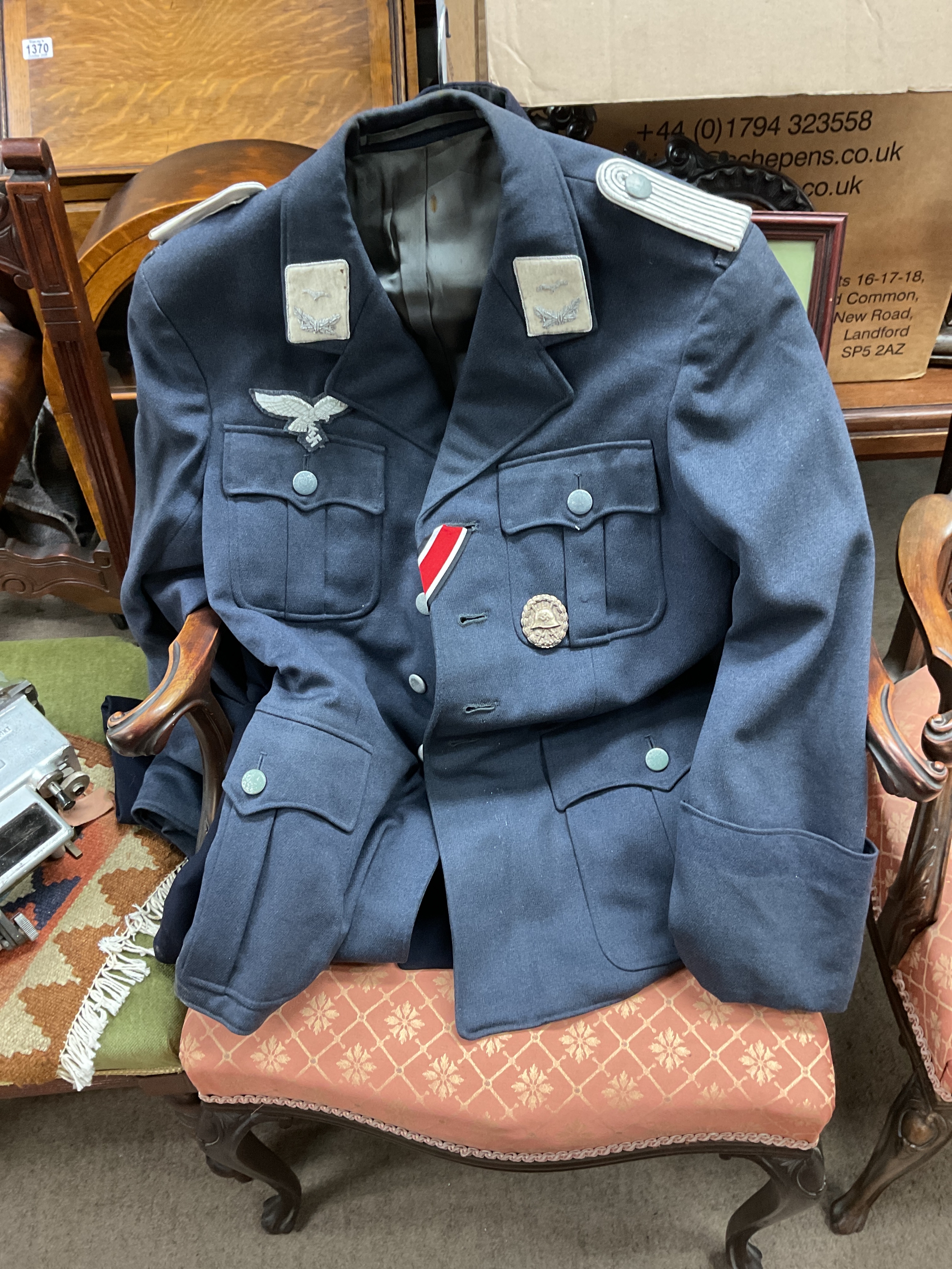 Reproduction Luftwaffe tunic with Iron Cross ribbon and wounds badge.