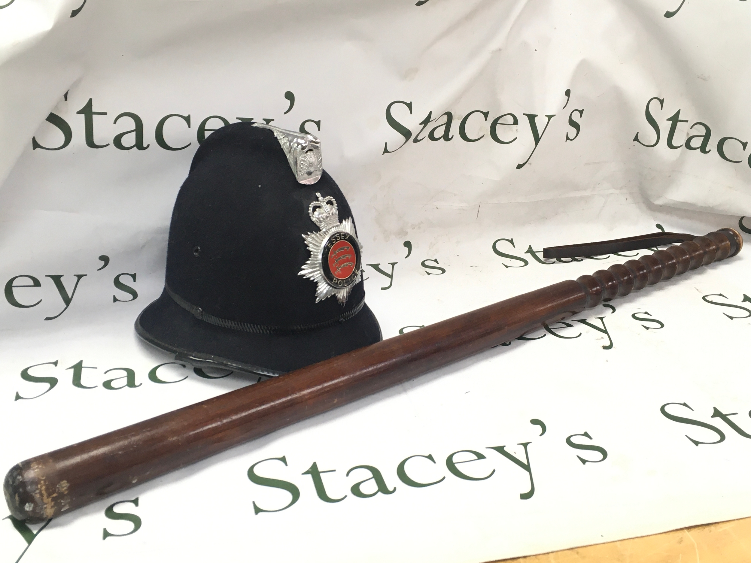 Essex police QE11R helmet (inside 16x20cm) and a large truncheon (89cm long)