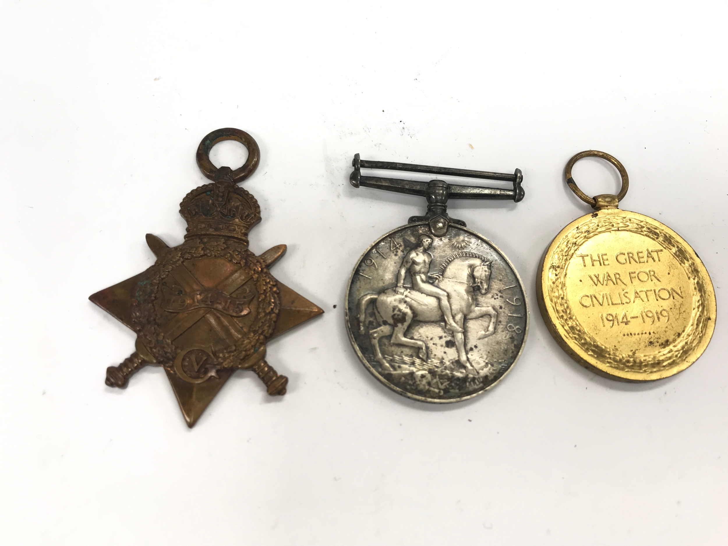 three British First World War campaign medals including a bronze 1914–15 Star awarded to PTE J KINGETT NORF. R